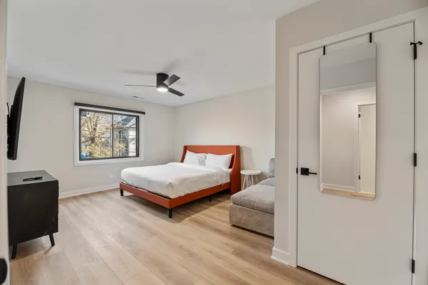 a bedroom with bed and window