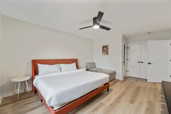 a bedroom with a bed and a dresser