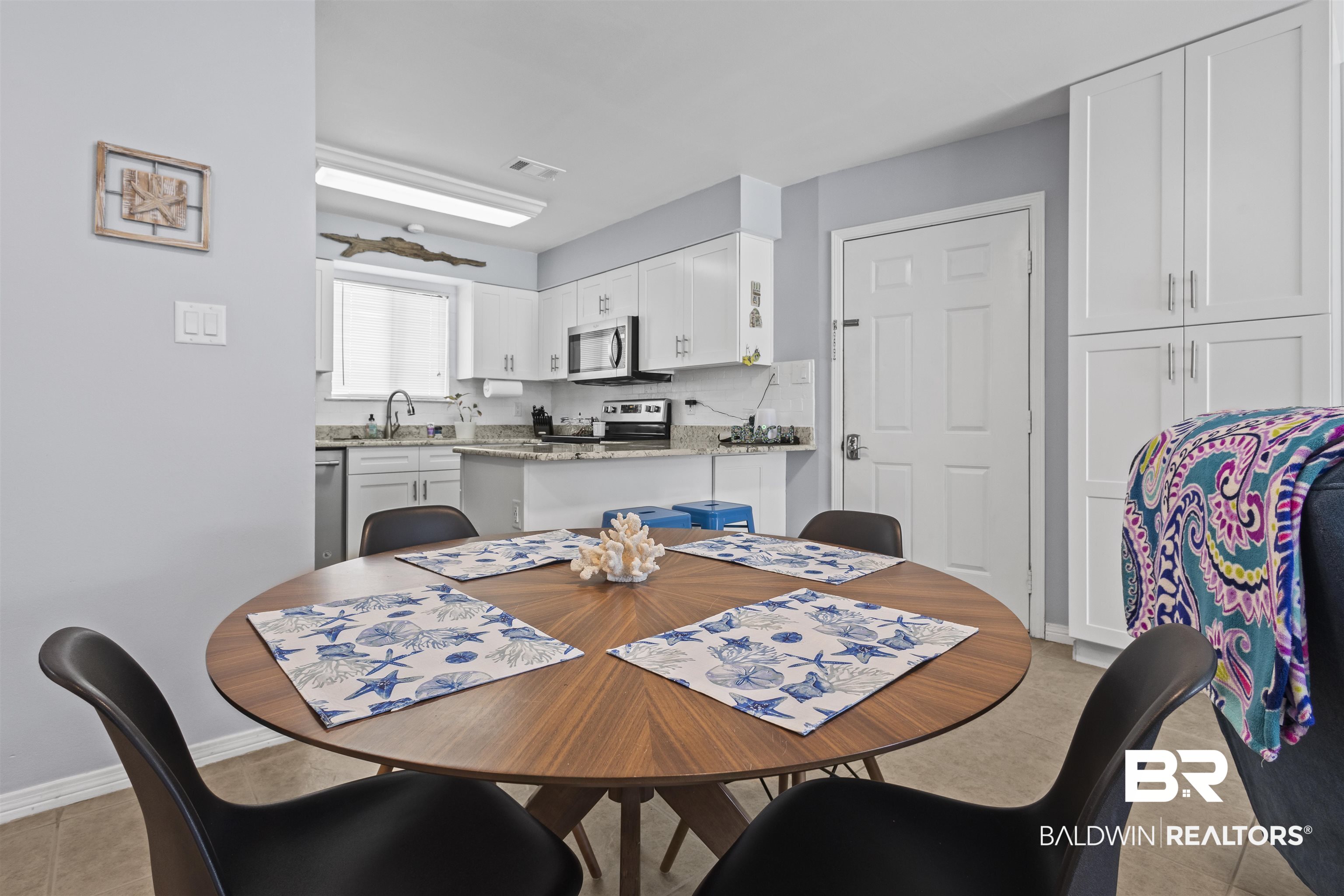 25925 Canal Road, Unit 207 Orange Beach, AL 36561 - Photo 15 of 42 Tiled dining space with sink