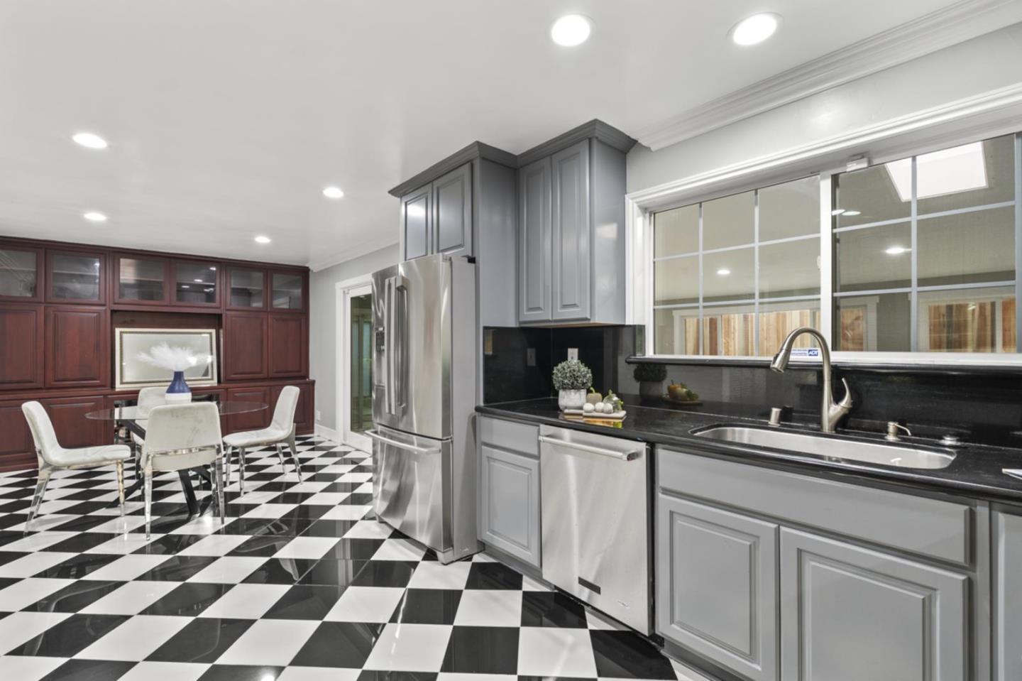 5150 Brookside Lane Concord, CA 94521 - Photo 15 of 51 a kitchen with stainless steel appliances a sink a stove a refrigerator and cabinets