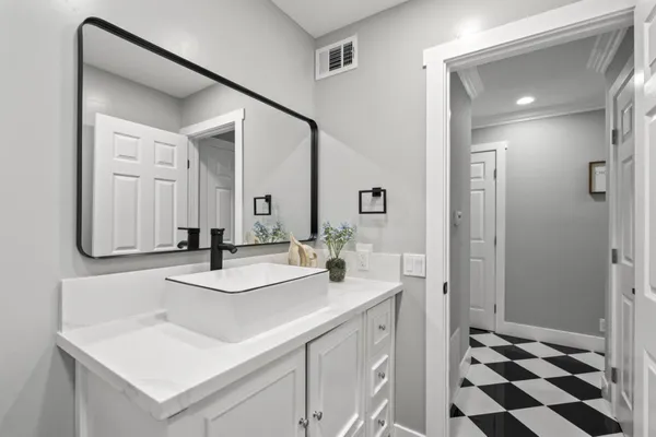 a bathroom with a shower and a glass door