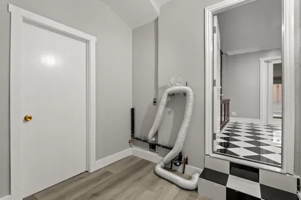 a bedroom with a bed and a chair