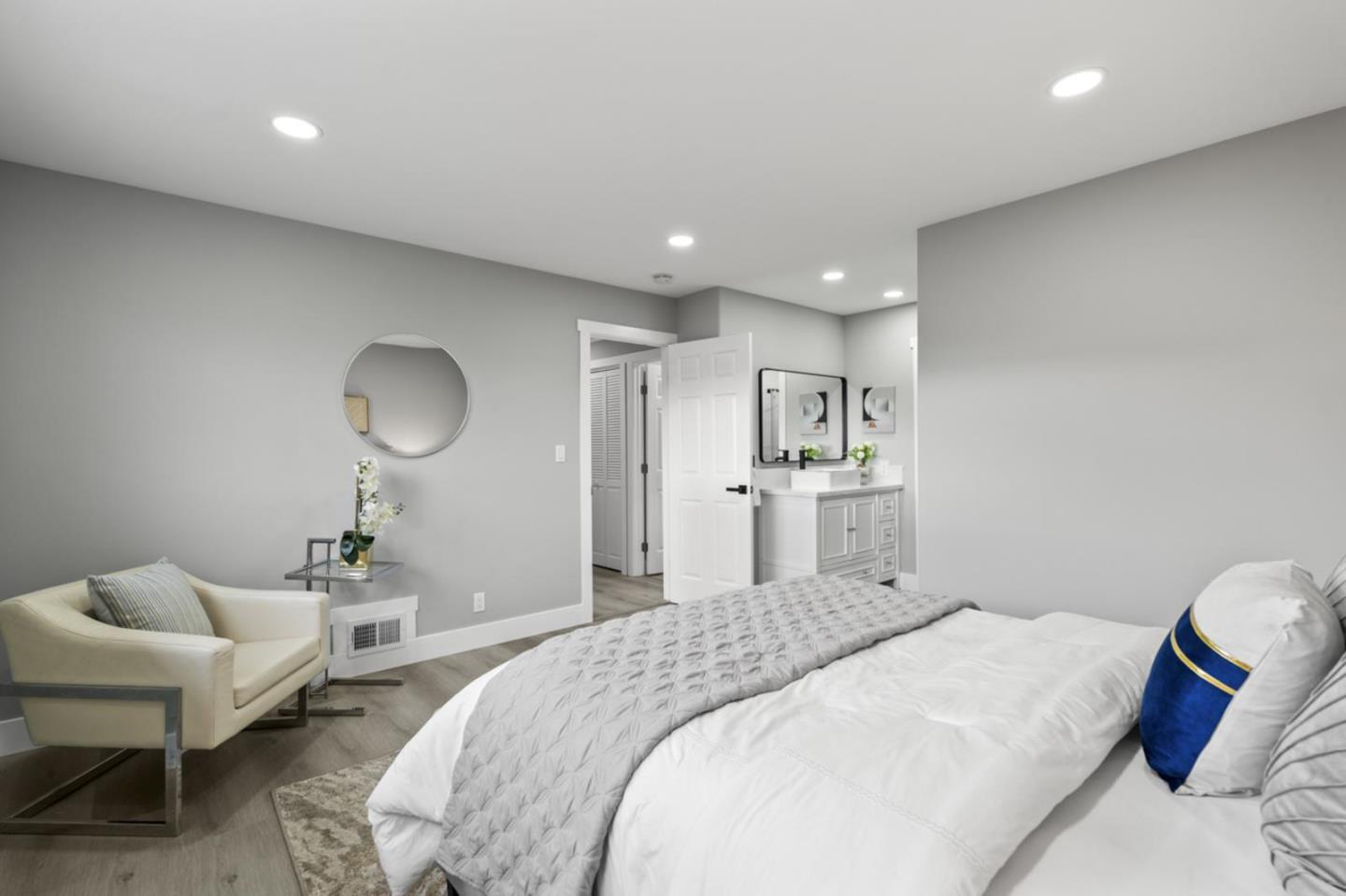 5150 Brookside Lane Concord, CA 94521 - Photo 31 of 51 a spacious bedroom with a bed and a chandelier