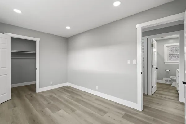a view of a room with shelf on the wall