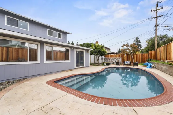 a front view of a house with swimming pool