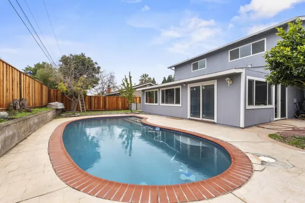 a view of swimming pool with outdoor seating
