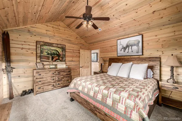 a bedroom with a bed and a walk in closet