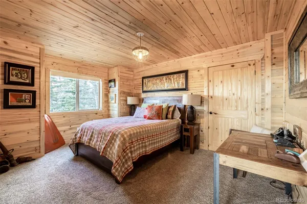 a bed room with a bed and a window