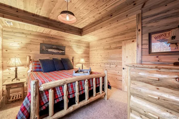 a view of a chair and tables in the balcony