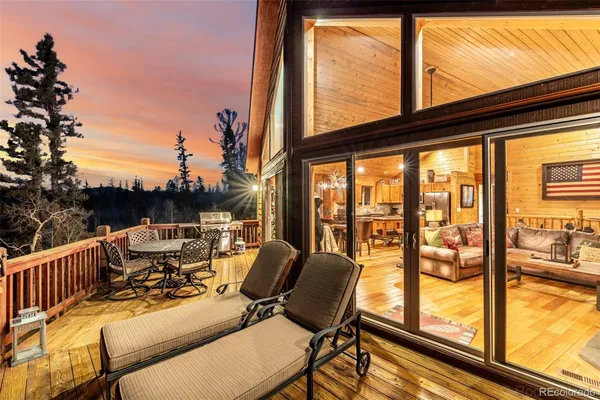 a view of balcony with furniture and wooden floor