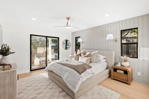 a bedroom with a large bed and a window