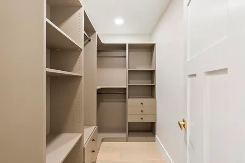 a bed room with a bed and a chair