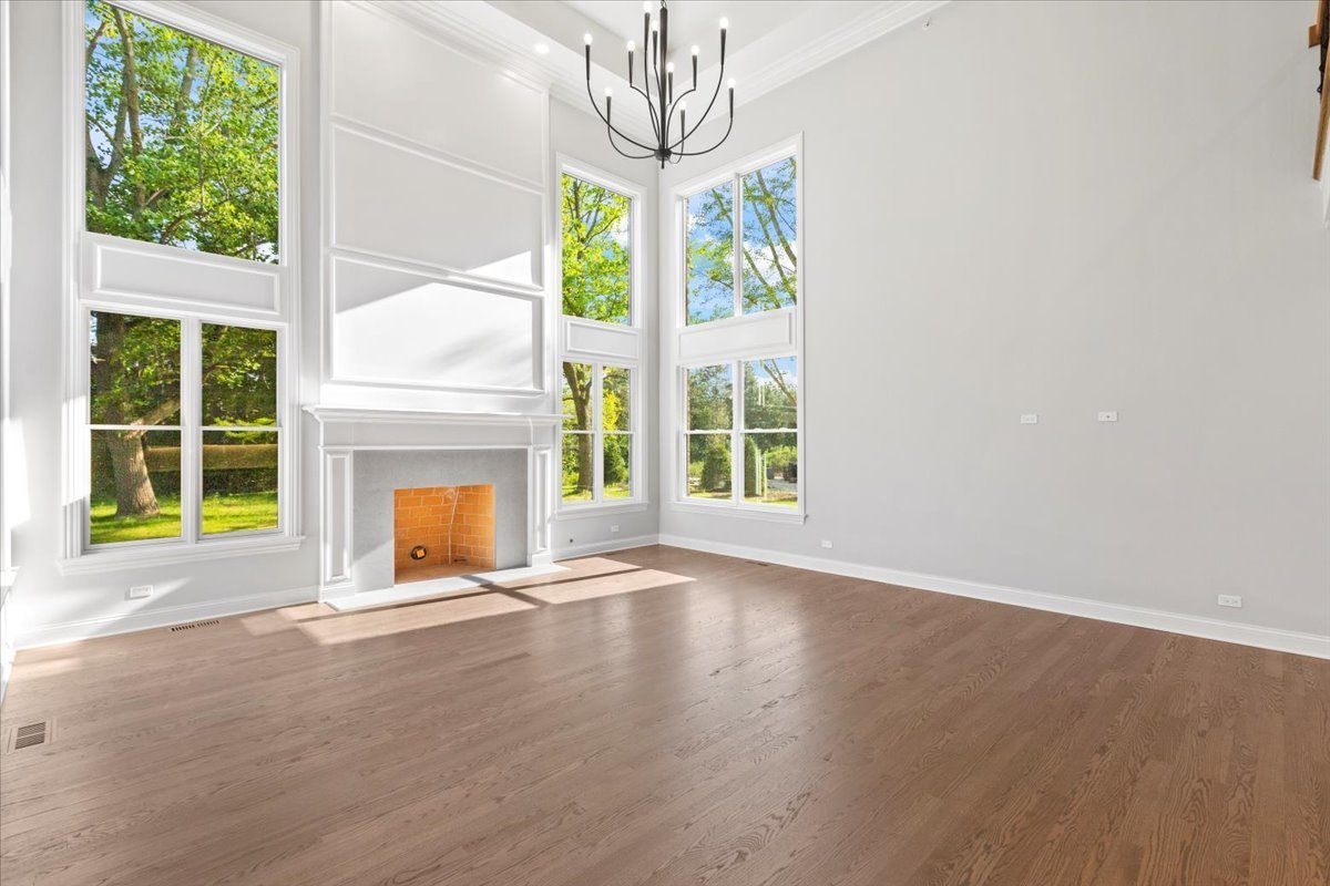 1 West Penny Road South Barrington, IL 60010 - Photo 11 of 30 a view of an empty room with windows and a fireplace