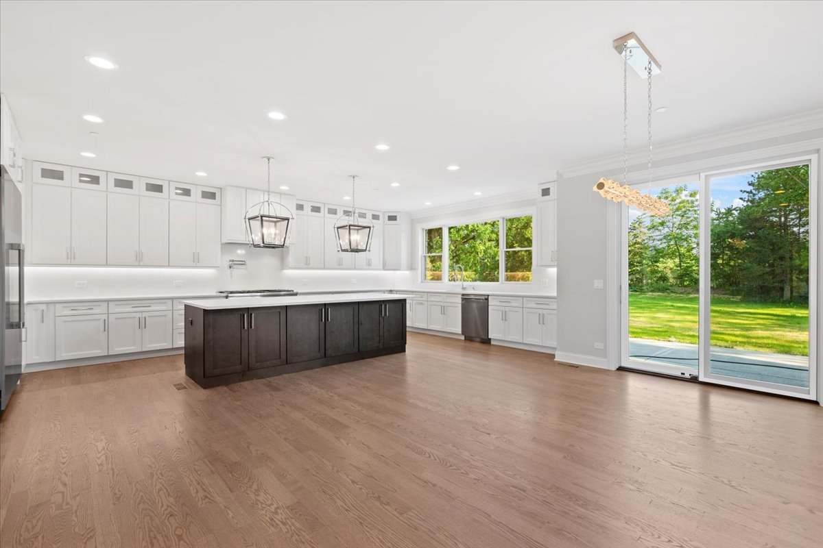 1 West Penny Road South Barrington, IL 60010 - Photo 13 of 30 a large white kitchen with a large window