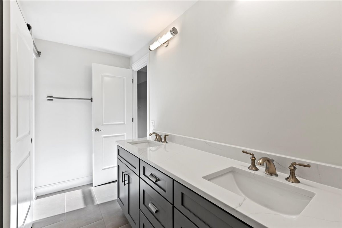 1 West Penny Road South Barrington, IL 60010 - Photo 16 of 30 a bathroom with a sink and a mirror
