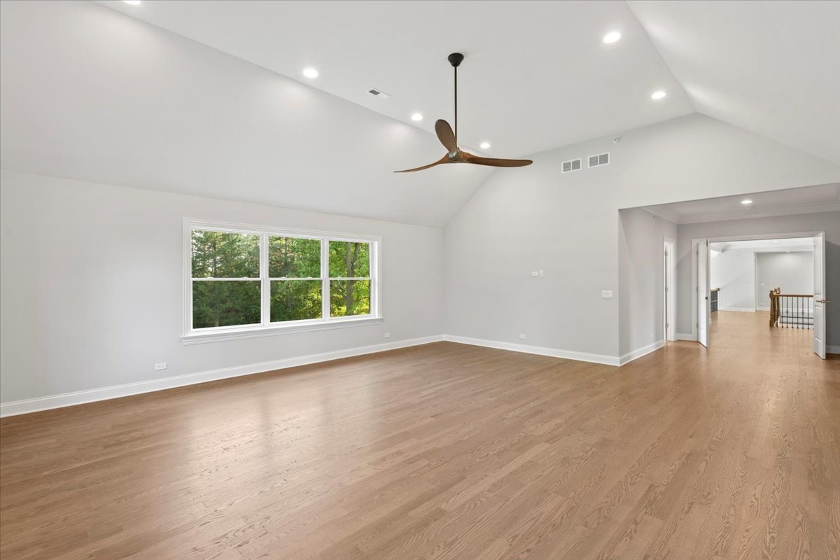 1 West Penny Road South Barrington, IL 60010 - Photo 19 of 30 a view of an empty room with a window and wooden floor