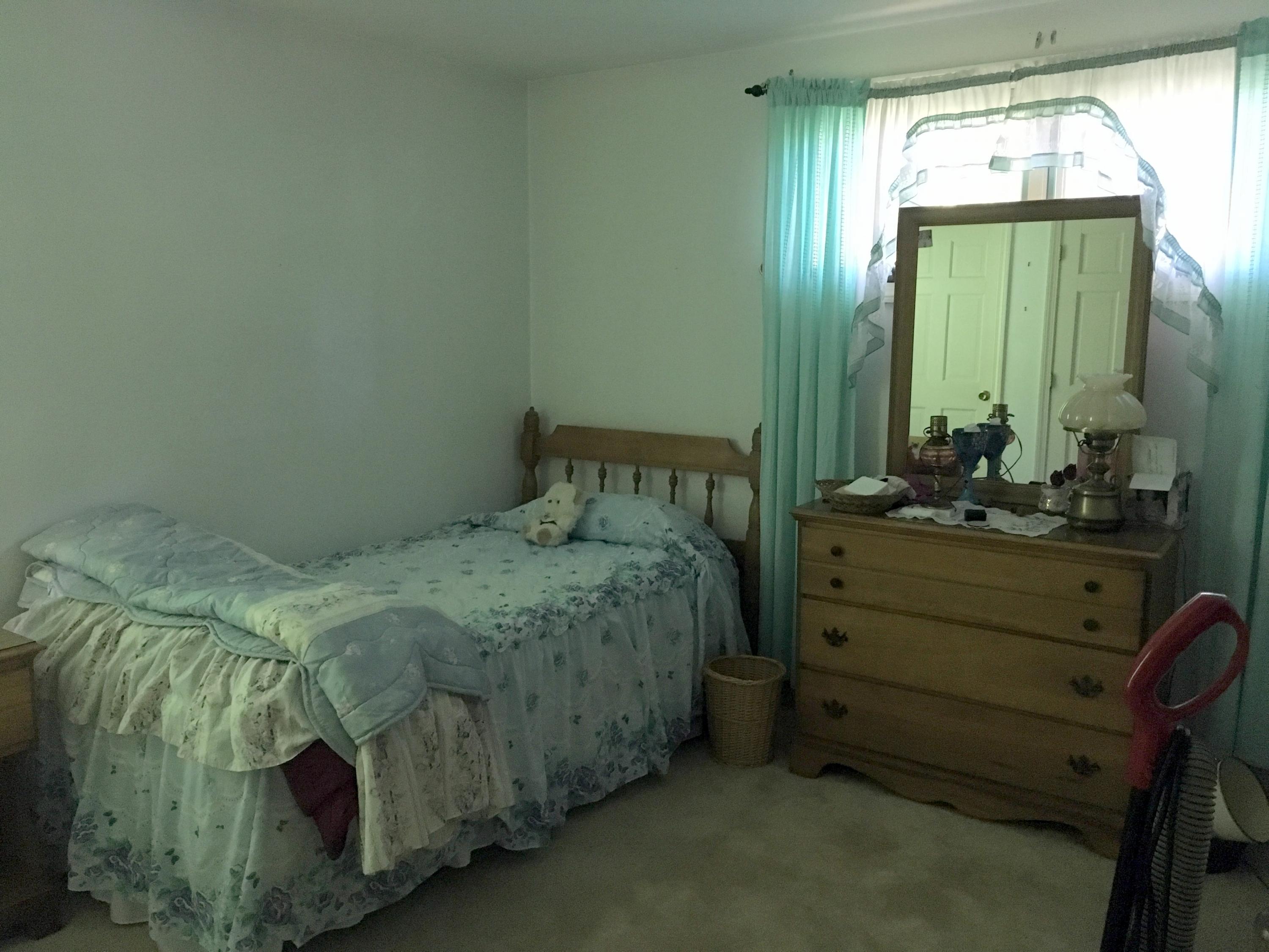 88 Cedric Road Centerville, MA 02632 - Photo 14 of 25 a bed sitting in a bedroom next to a window