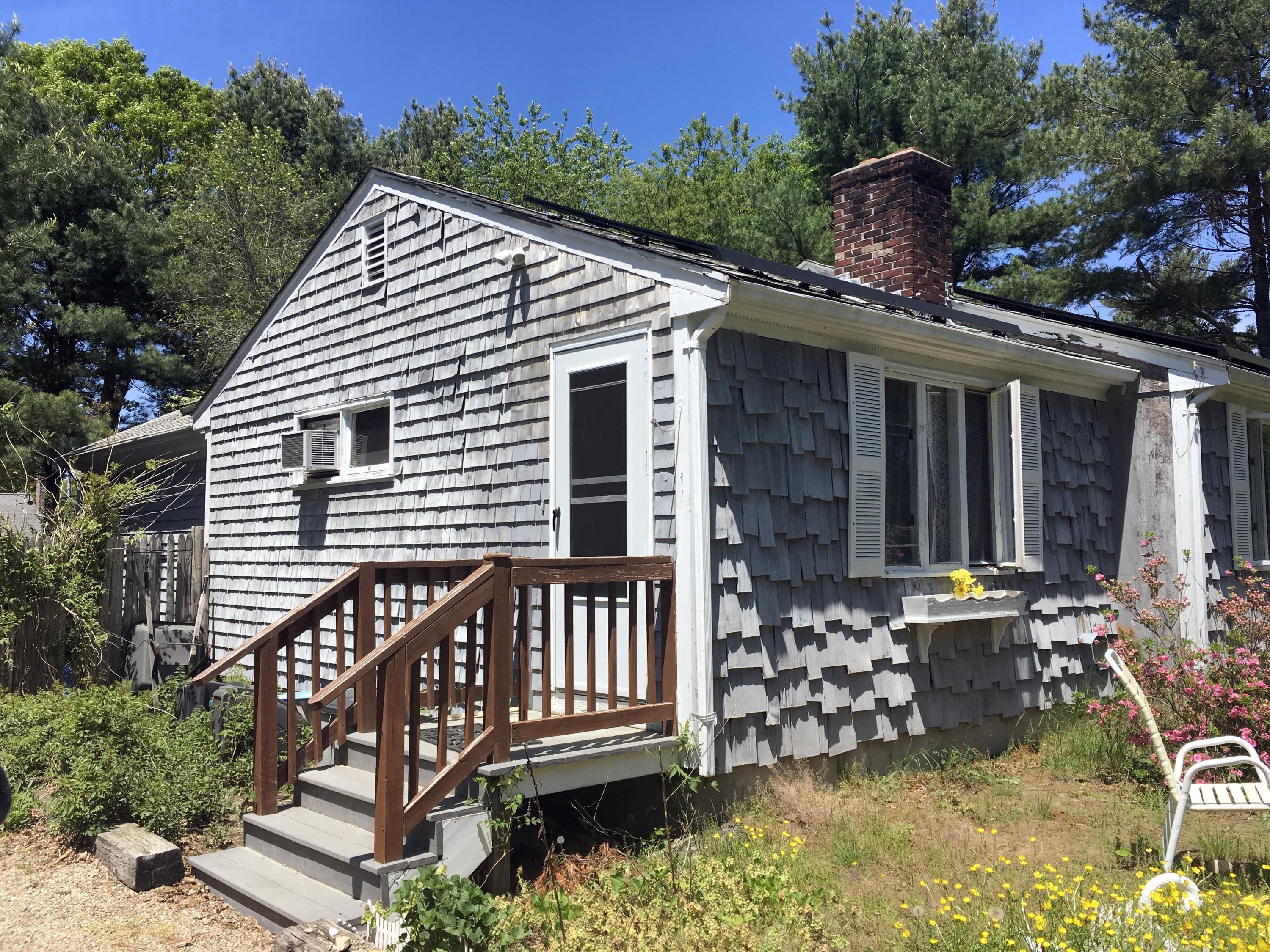 88 Cedric Road Centerville, MA 02632 - Photo 22 of 25 a view of a house with backyard and sitting area