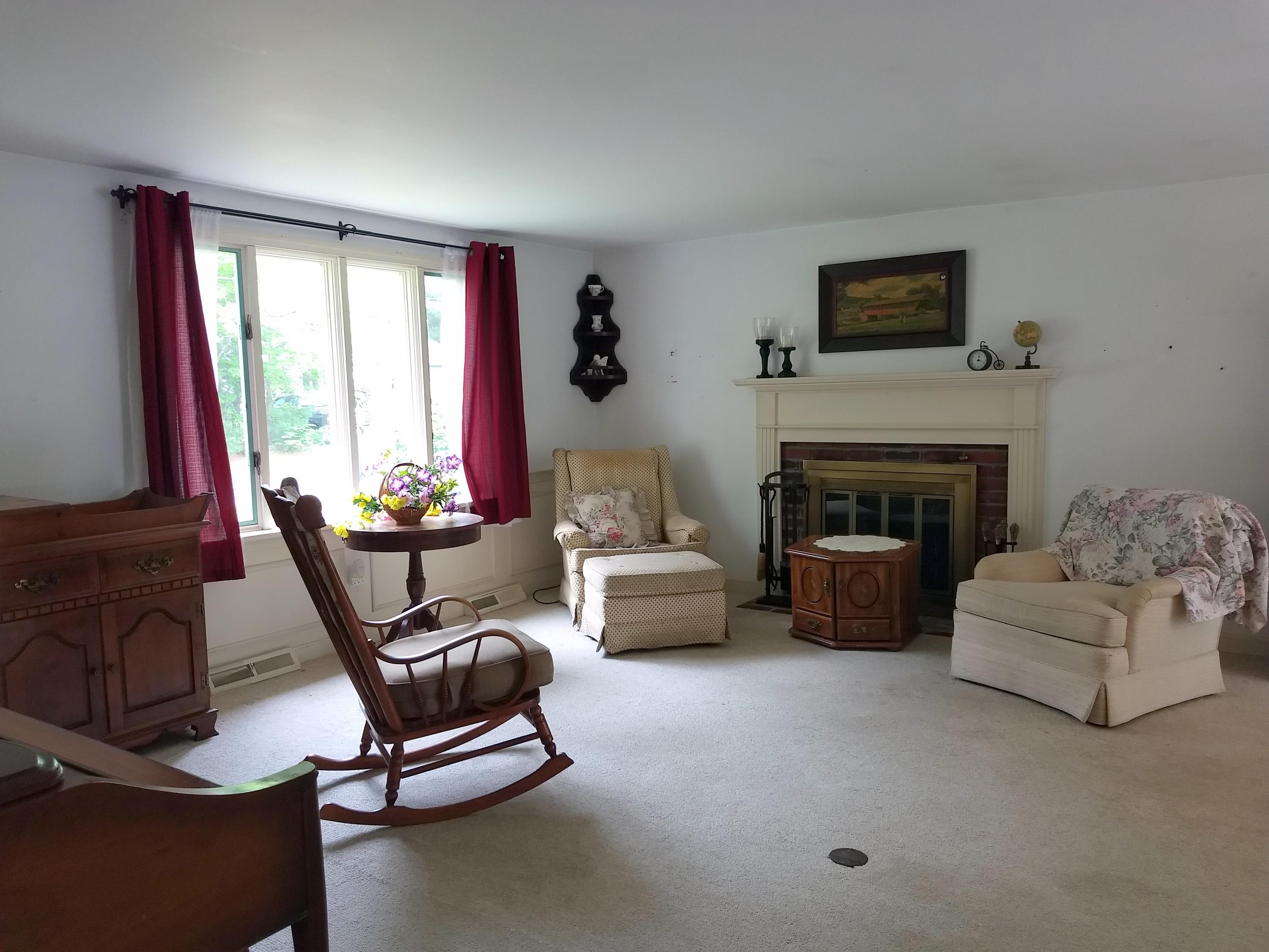 88 Cedric Road Centerville, MA 02632 - Photo 4 of 25 a living room with furniture and a fireplace