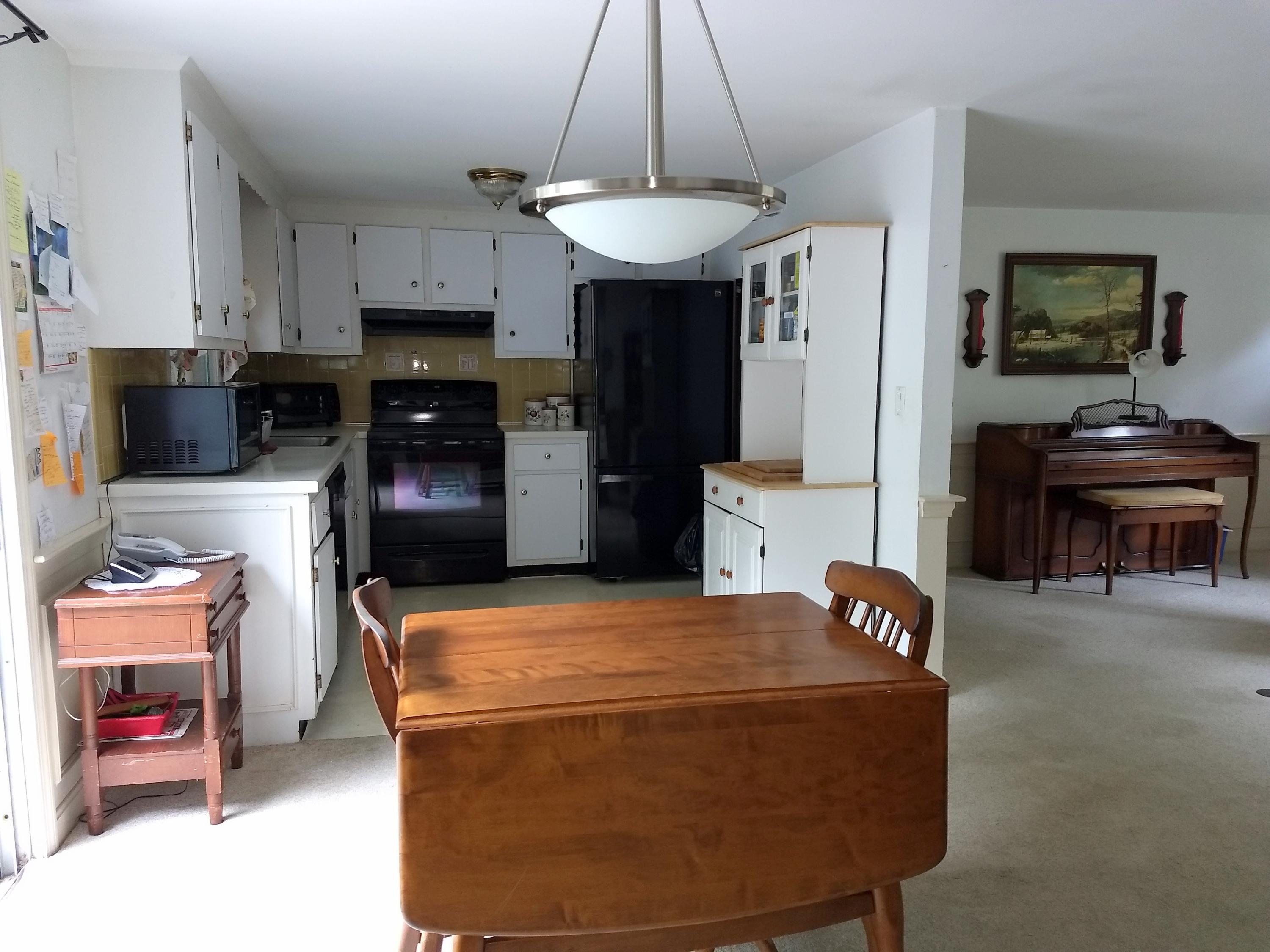 88 Cedric Road Centerville, MA 02632 - Photo 7 of 25 a kitchen with a refrigerator and a stove