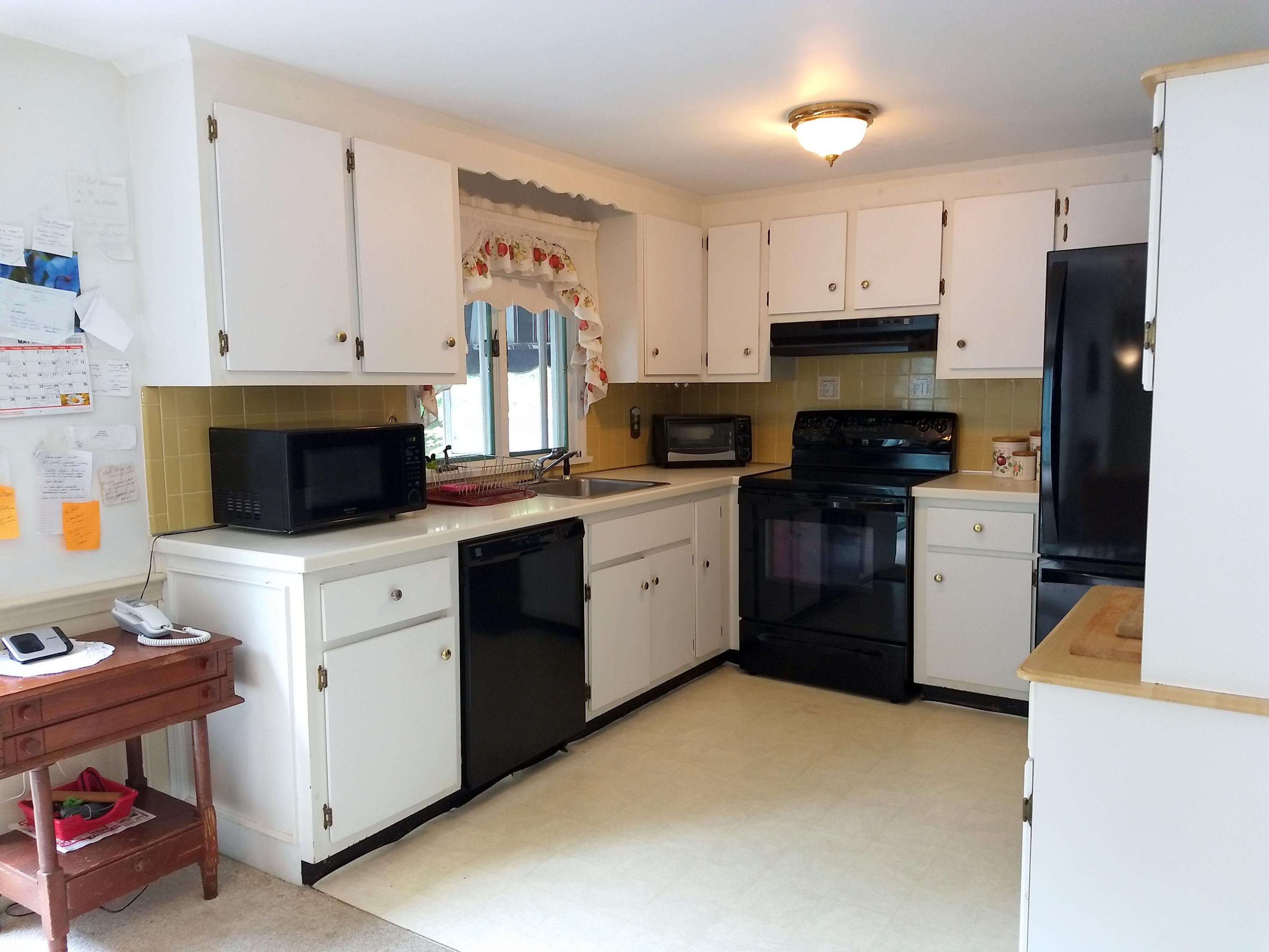 88 Cedric Road Centerville, MA 02632 - Photo 8 of 25 a kitchen with cabinets stainless steel appliances and a counter space