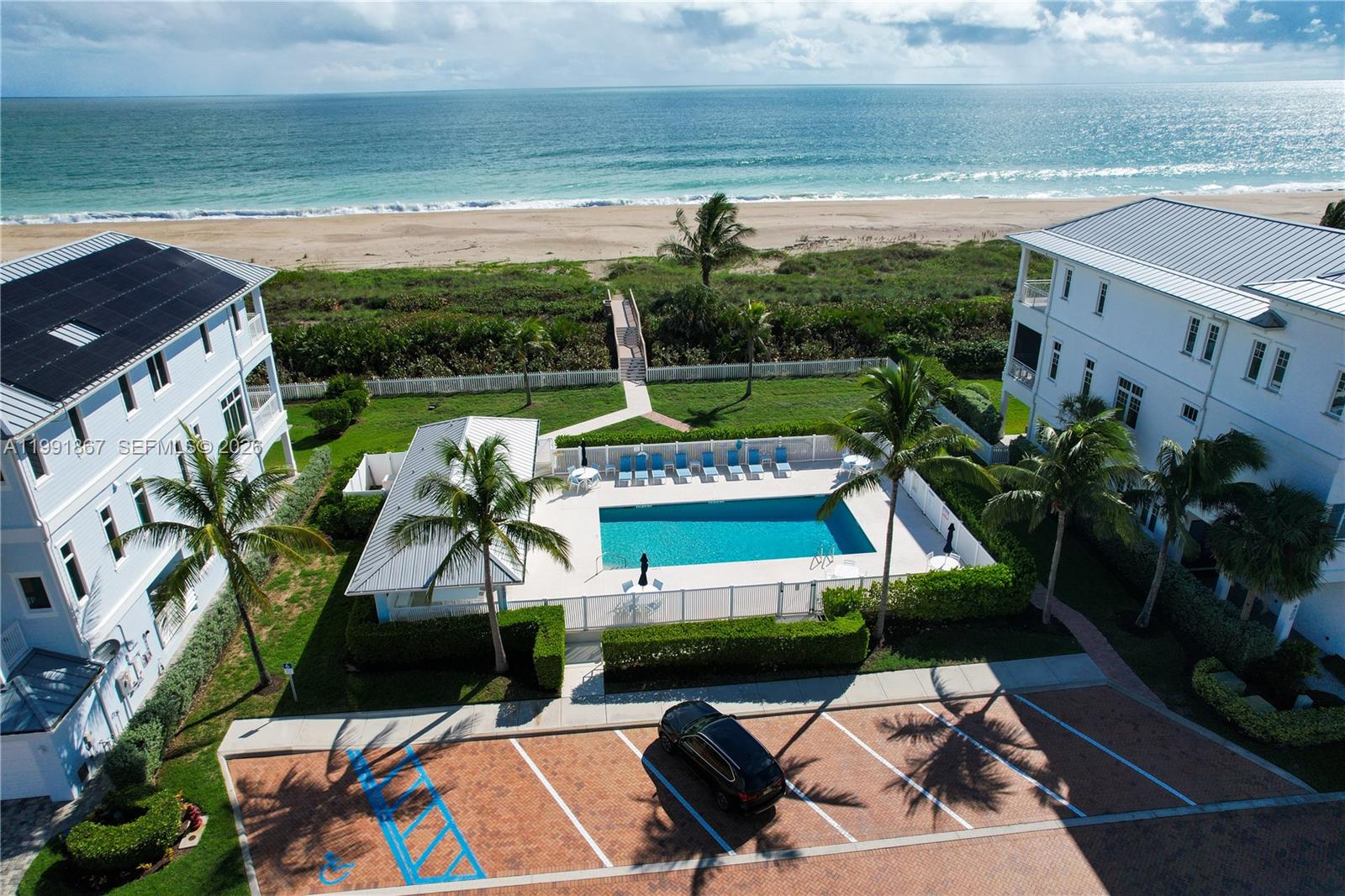 5028 Watersong Way Fort Pierce, FL 34949 - Photo 18 of 24 a view of a swimming pool with lounge chairs in the patio