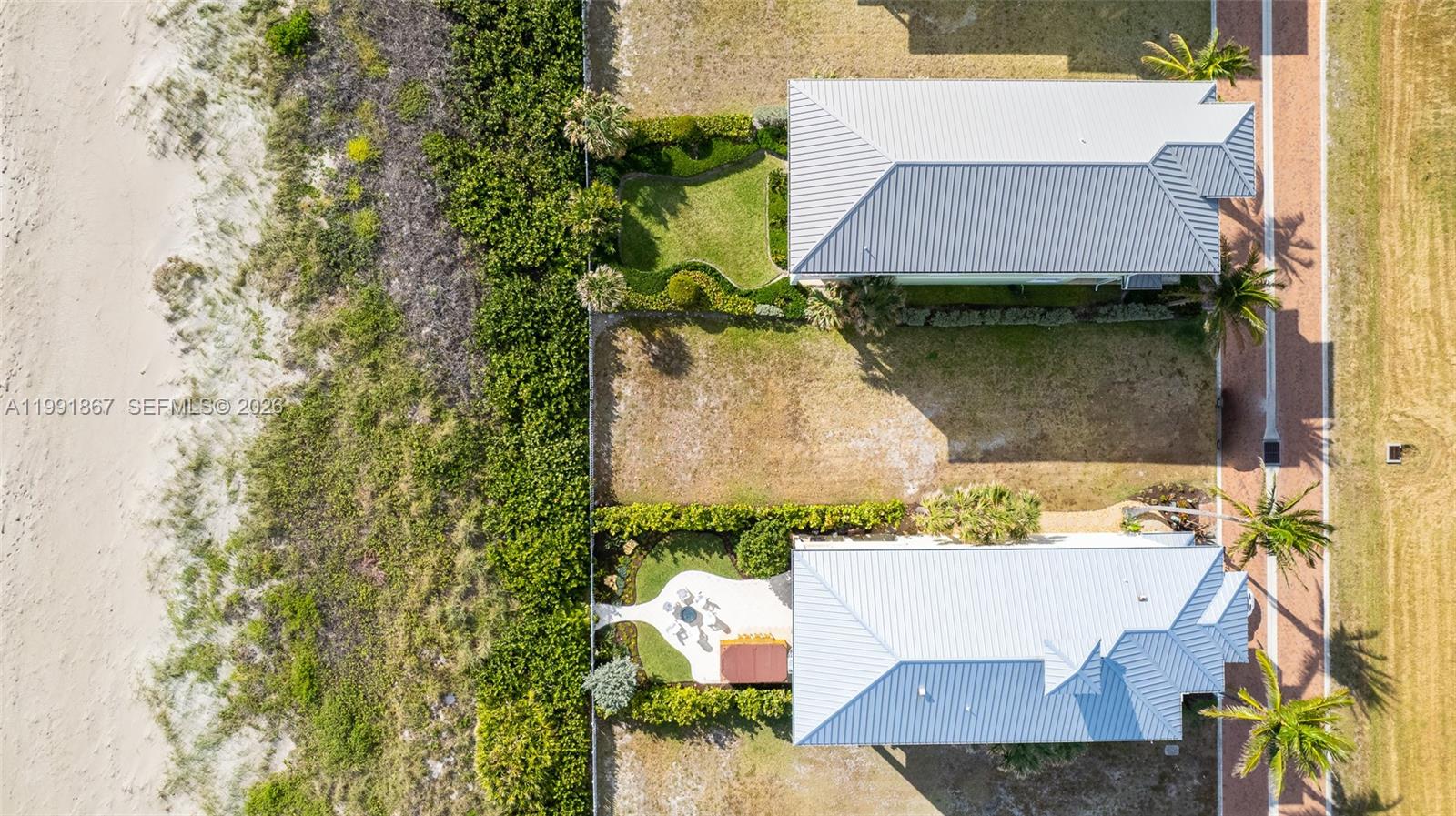 5028 Watersong Way Fort Pierce, FL 34949 - Photo 5 of 24 an aerial view of a house with a yard and a wooden fence