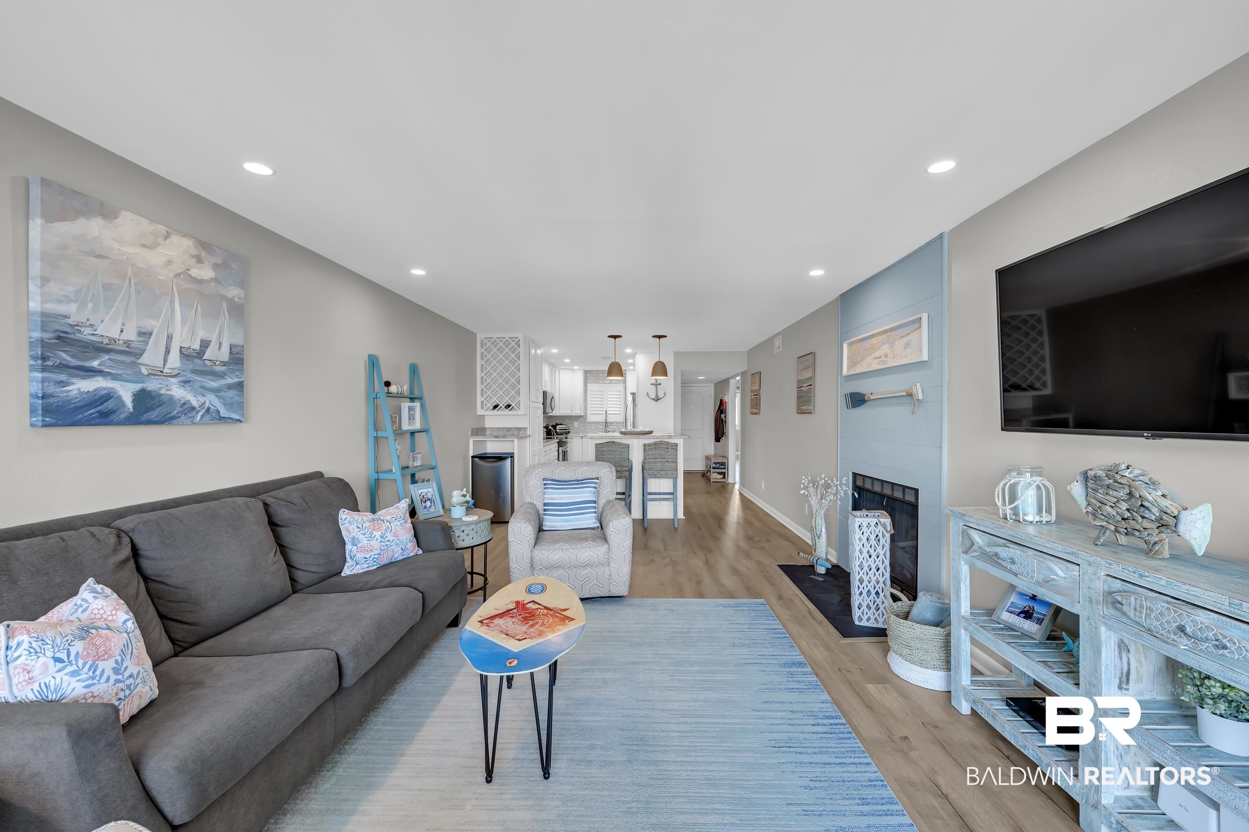 14100 River Road, Unit 211 Pensacola, FL 32507 - Photo 14 of 56 Open concept living area featuring recessed lighting and wood-finish flooring