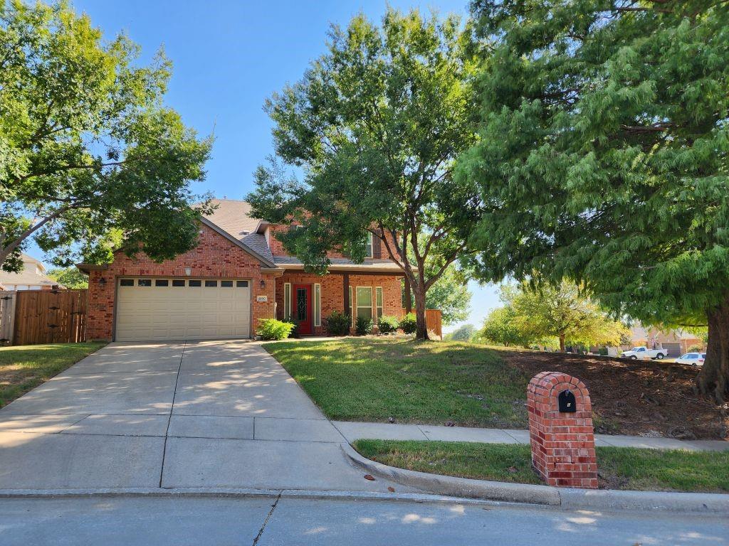 1900 Covington Lane Corinth, TX 76210 - Photo 1 of 1 a front view of a house with a yard and garage