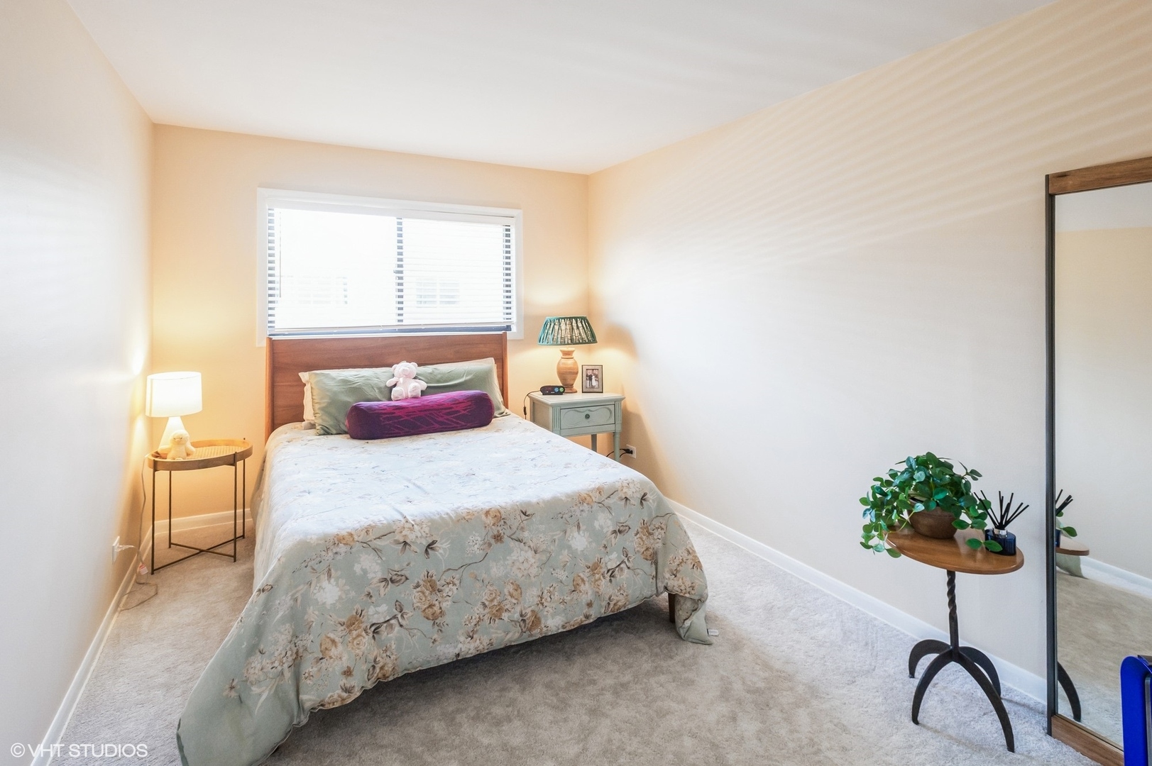 10021 Frontage Road, Unit F Skokie, IL 60077 - Photo 15 of 25 a bedroom with a bed and a potted plant