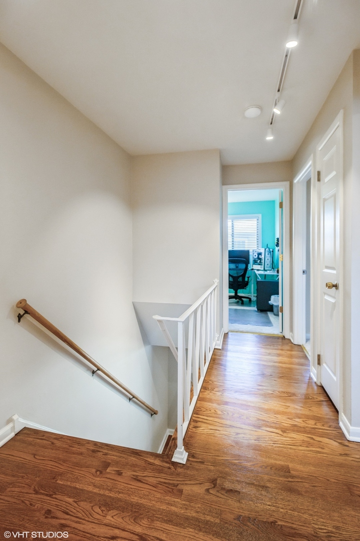 10021 Frontage Road, Unit F Skokie, IL 60077 - Photo 18 of 25 a view of a hallway with wooden floor
