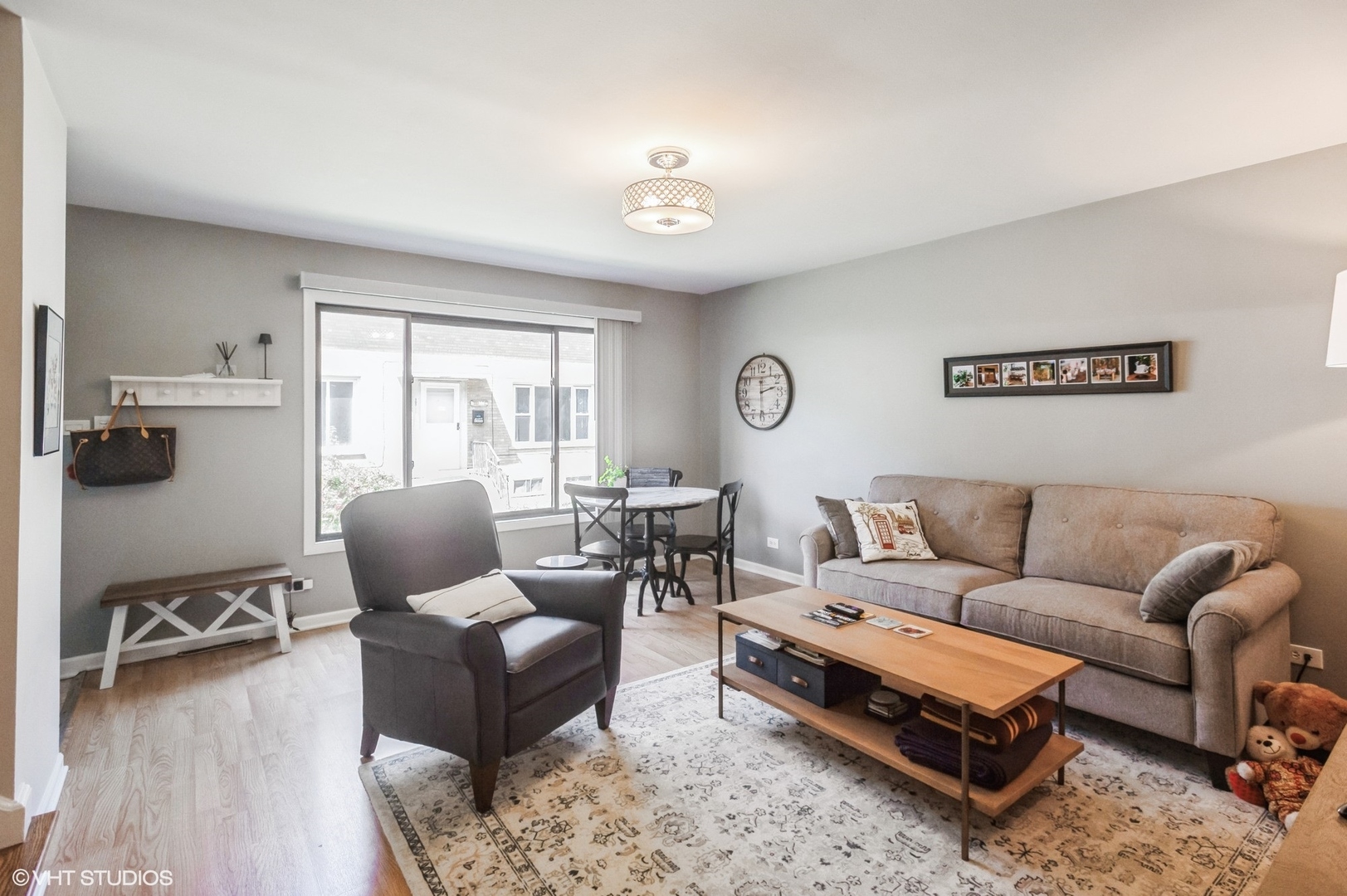 10021 Frontage Road, Unit F Skokie, IL 60077 - Photo 5 of 25 a living room with furniture and a window
