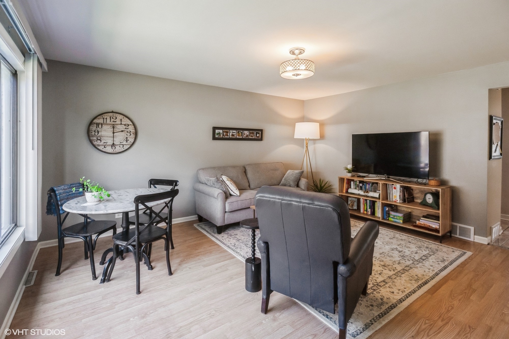 10021 Frontage Road, Unit F Skokie, IL 60077 - Photo 6 of 25 a living room with furniture and a flat screen tv