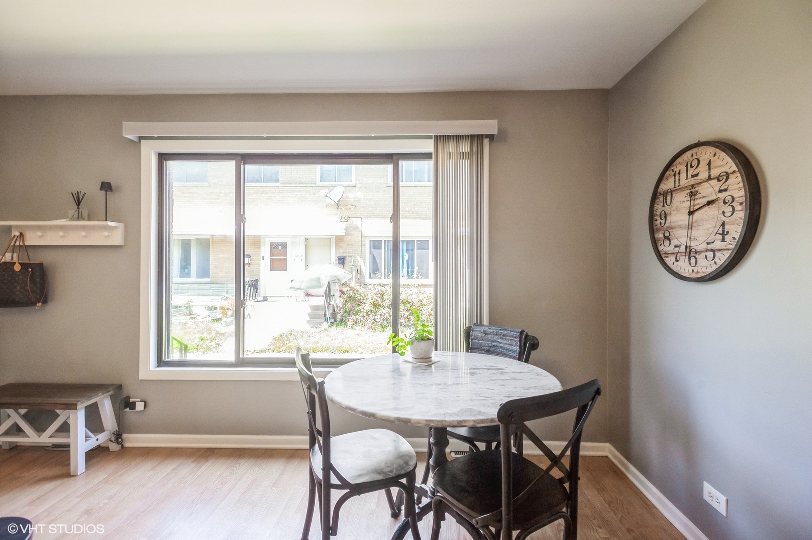 10021 Frontage Road, Unit F Skokie, IL 60077 - Photo 8 of 25 a view of a dining room with furniture window and outside view