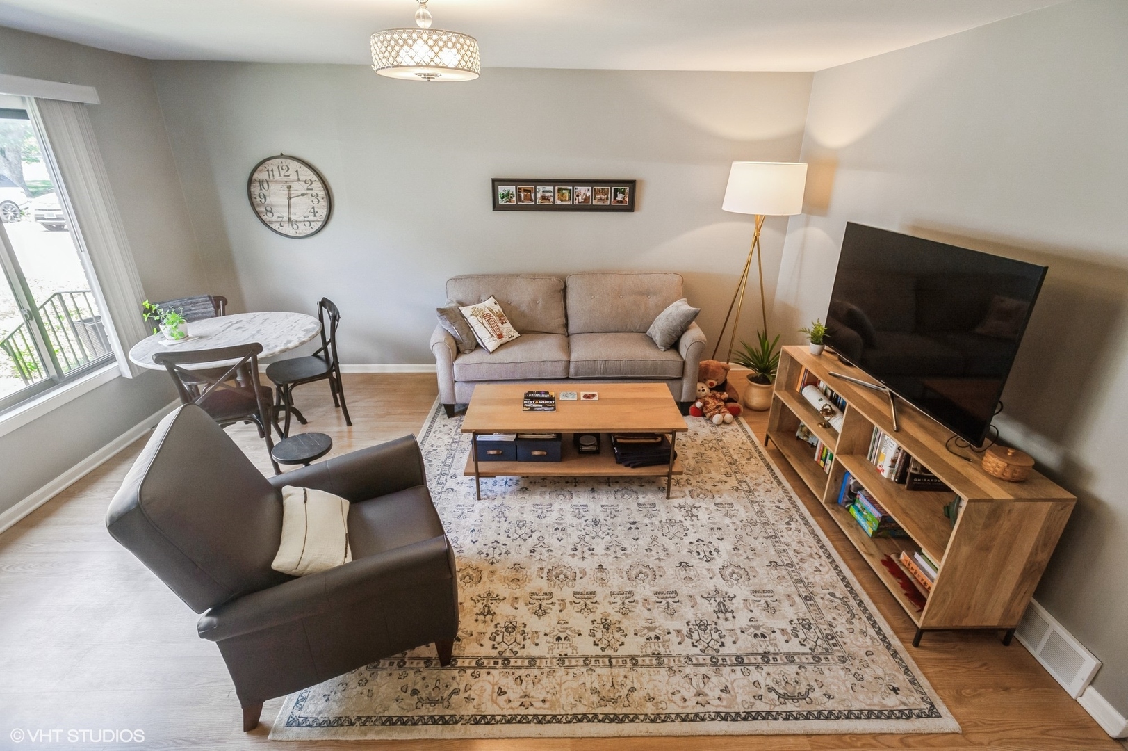10021 Frontage Road, Unit F Skokie, IL 60077 - Photo 9 of 25 a living room with furniture and a flat screen tv