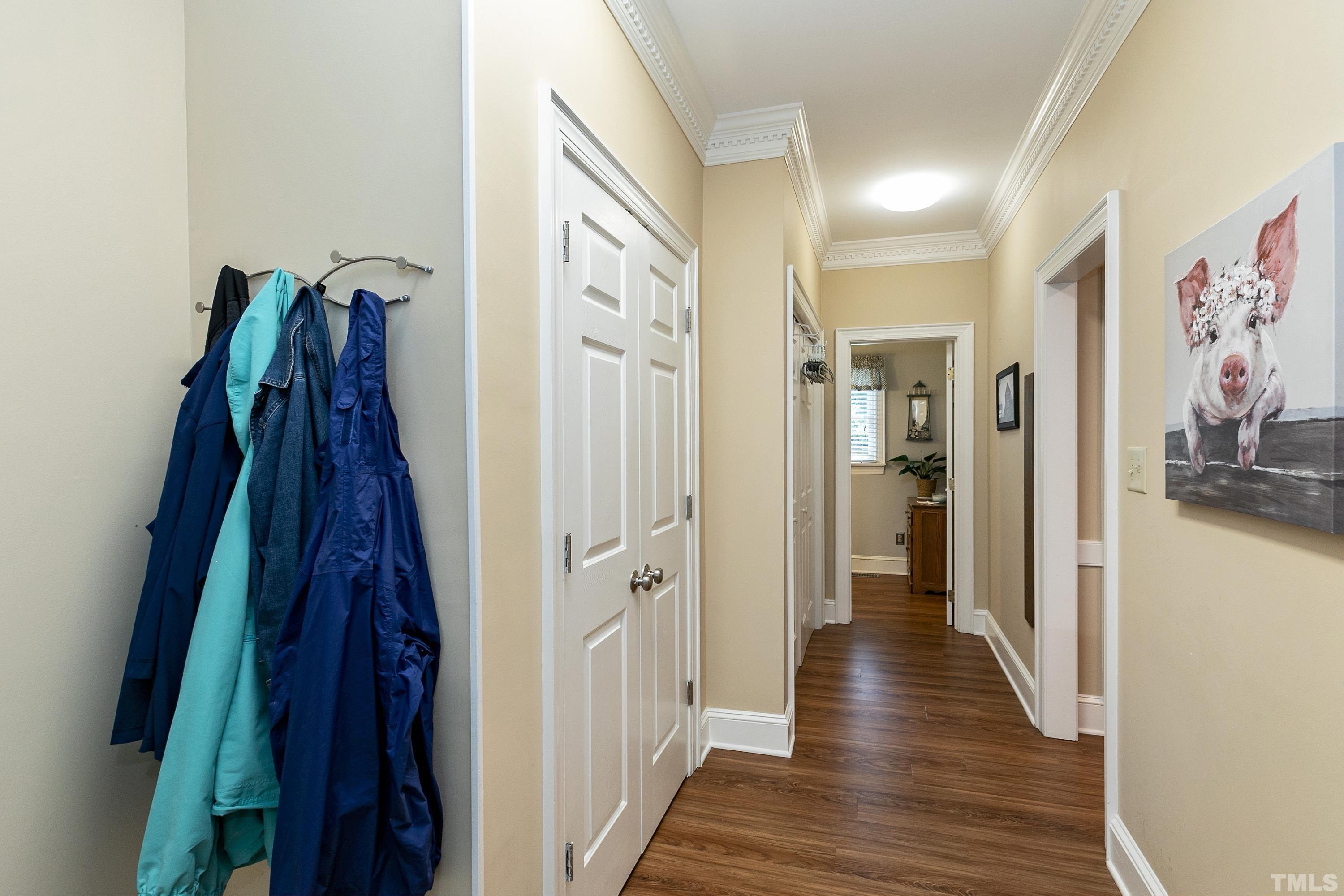 2905 Kenwick Court Raleigh, NC 27613 - Photo 19 of 45 a view of a hallway with wooden floor and closet