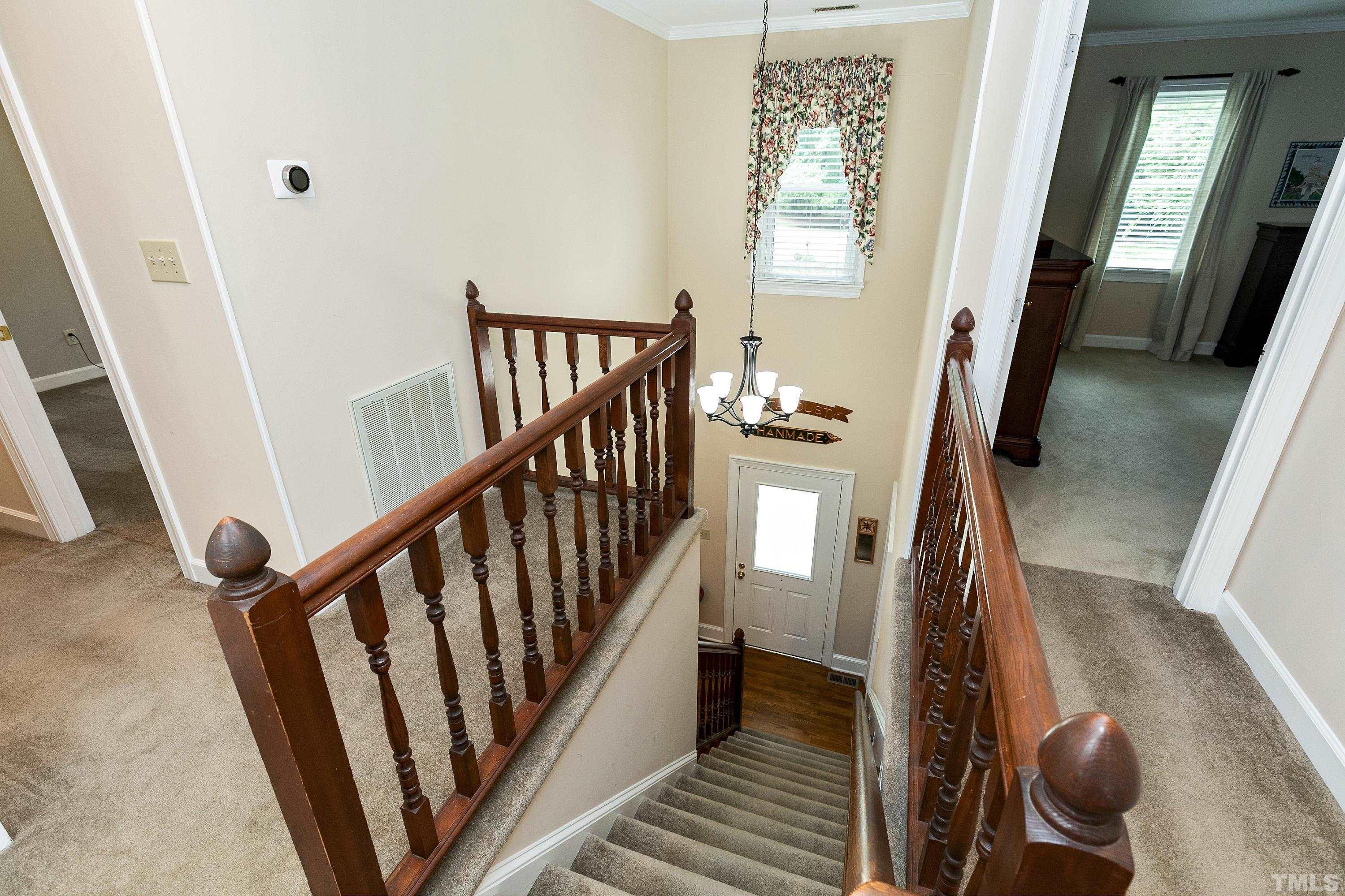 2905 Kenwick Court Raleigh, NC 27613 - Photo 21 of 45 a view of an entryway with wooden floor