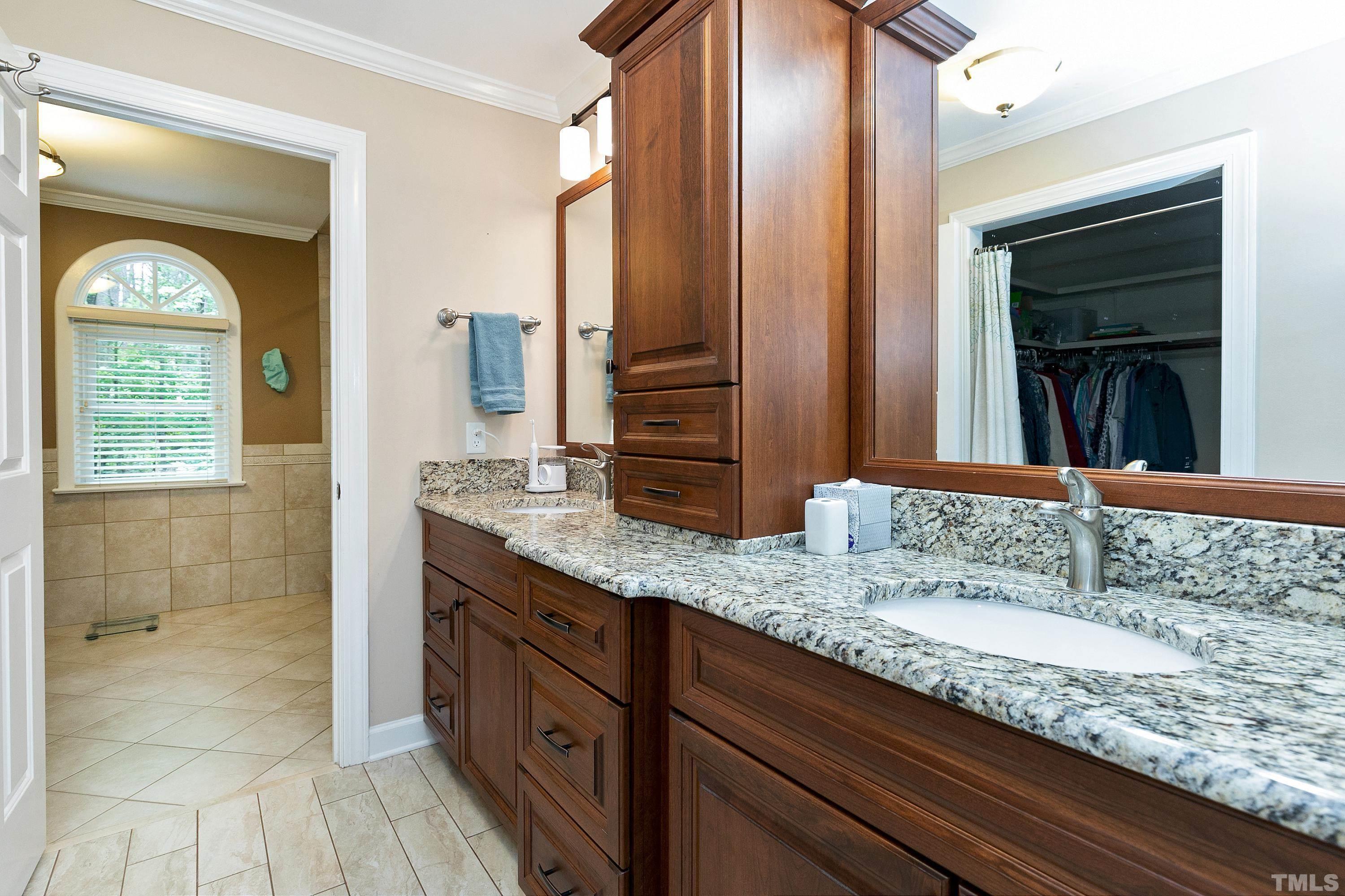 2905 Kenwick Court Raleigh, NC 27613 - Photo 24 of 45 a bathroom with a granite countertop sink and a mirror