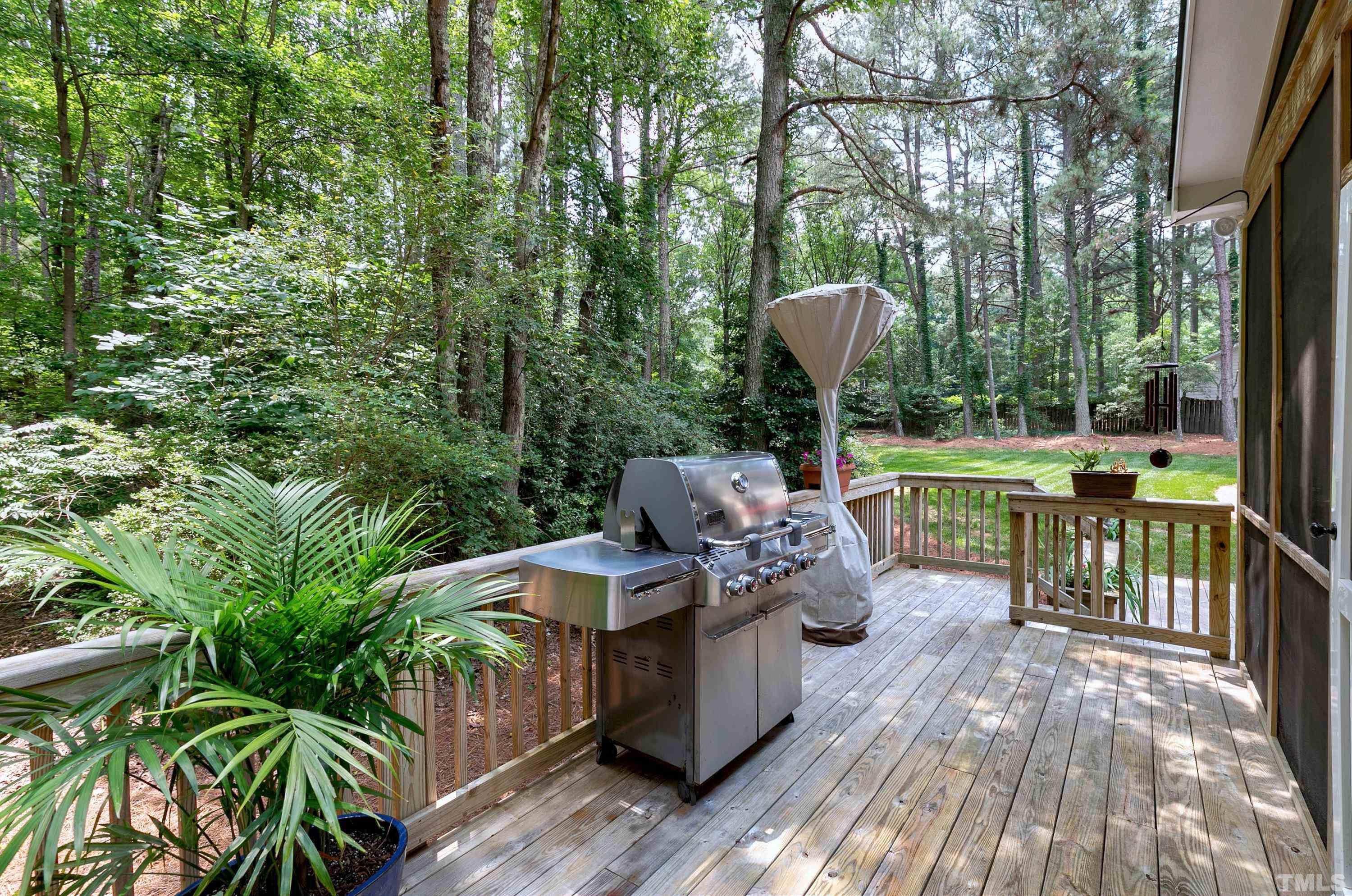 2905 Kenwick Court Raleigh, NC 27613 - Photo 39 of 45 a view of a chairs and table in the patio with a yard