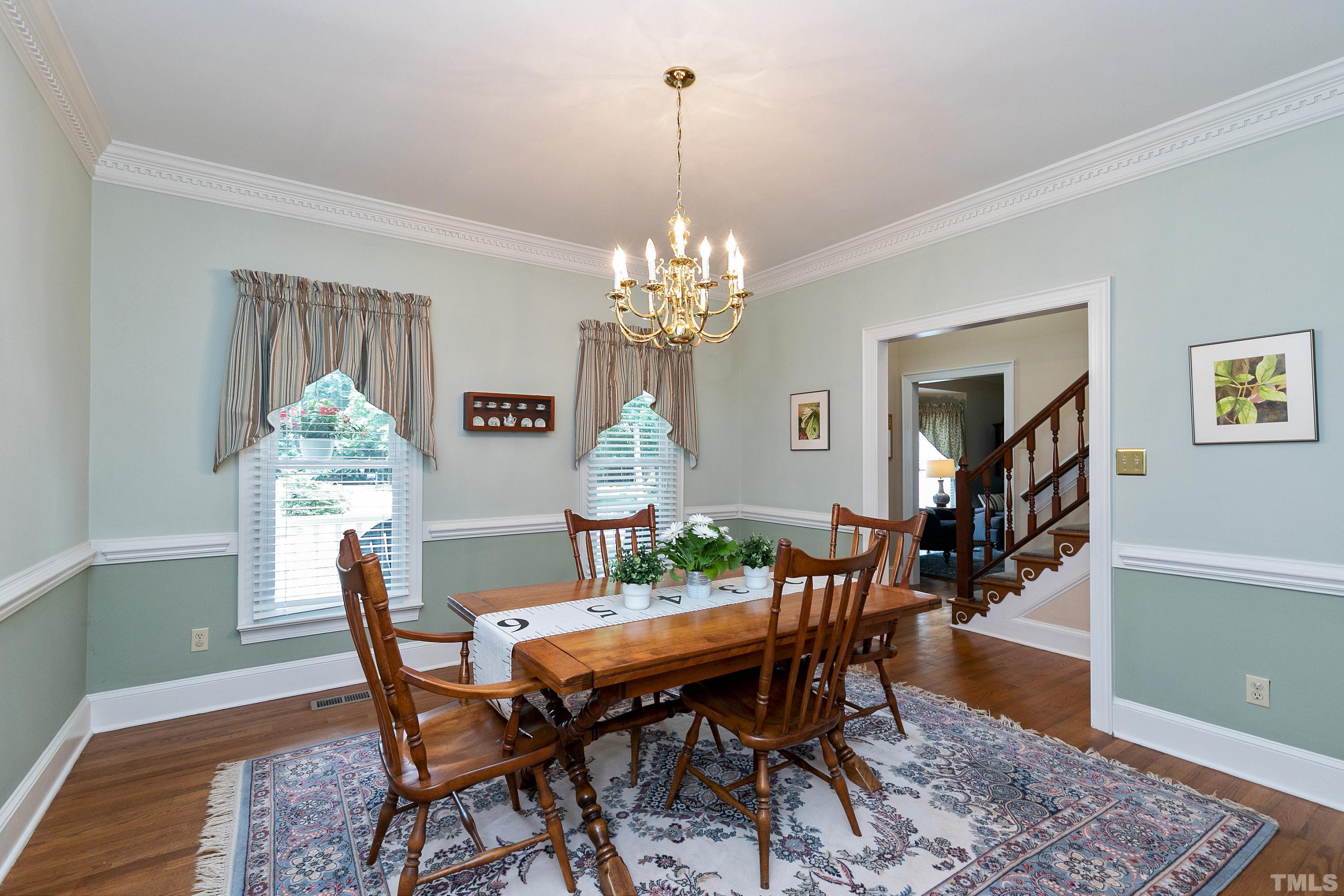 2905 Kenwick Court Raleigh, NC 27613 - Photo 4 of 45 a view of a dining room with furniture and chandelier