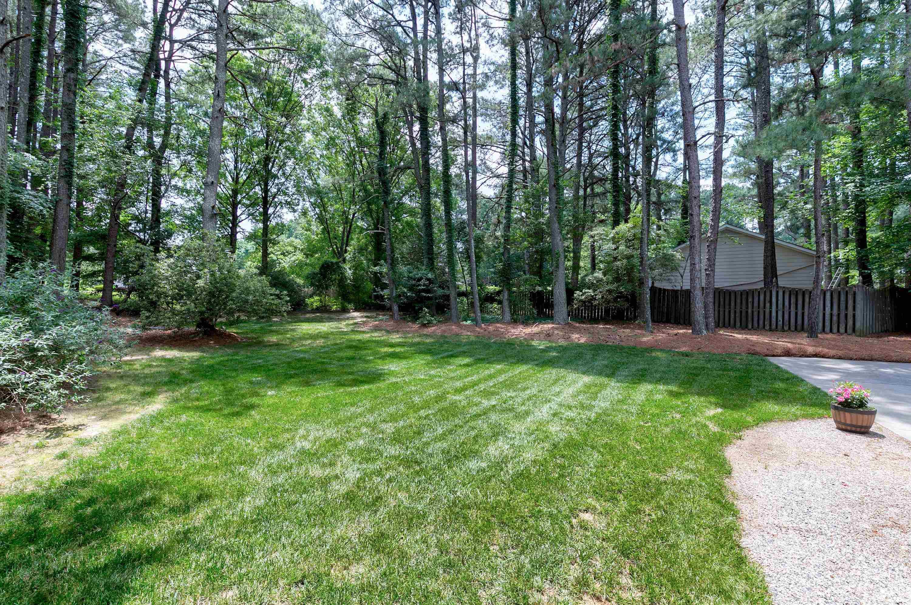 2905 Kenwick Court Raleigh, NC 27613 - Photo 41 of 45 a view of a backyard with large trees