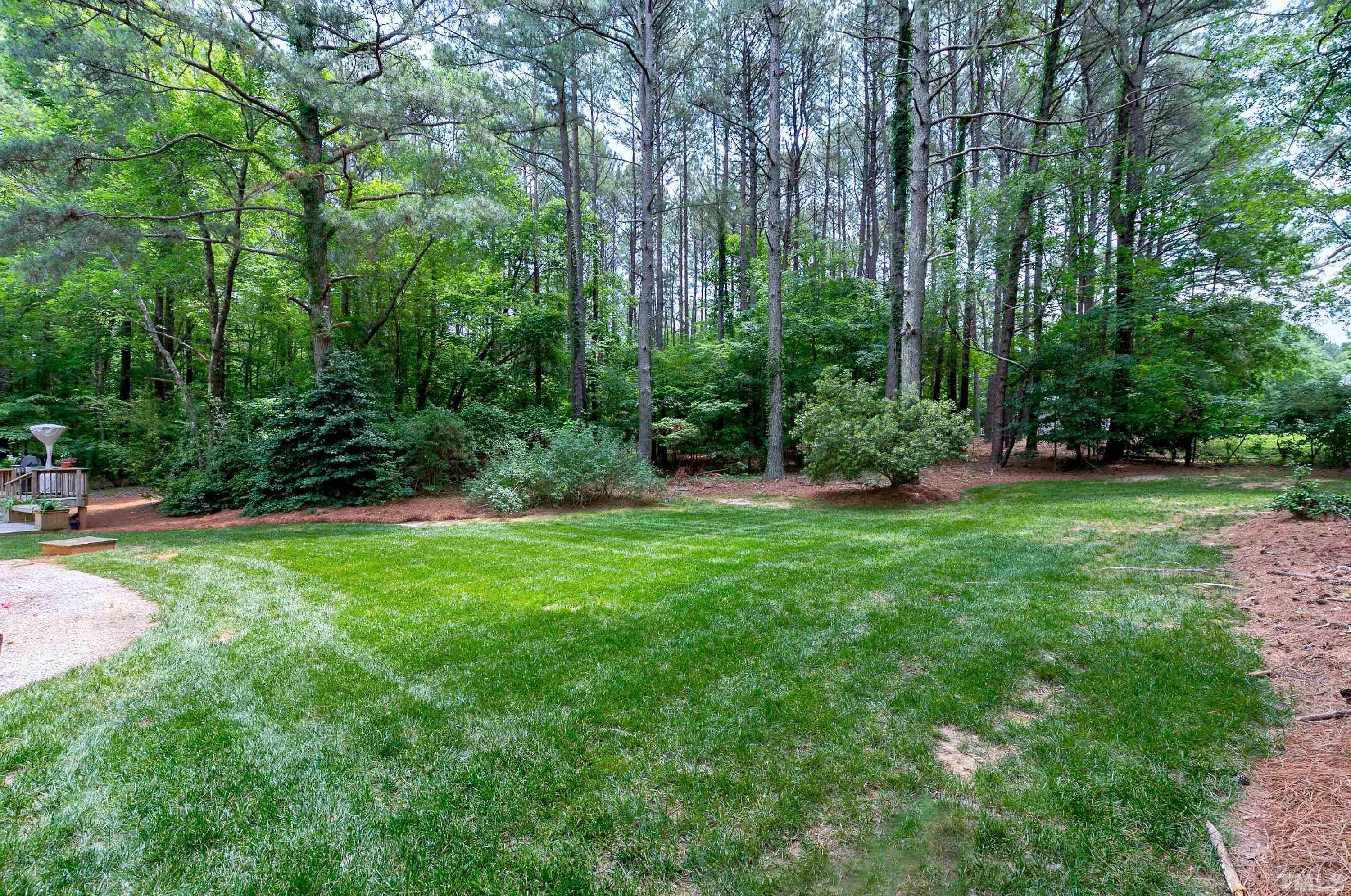 2905 Kenwick Court Raleigh, NC 27613 - Photo 42 of 45 a view of a backyard with a garden
