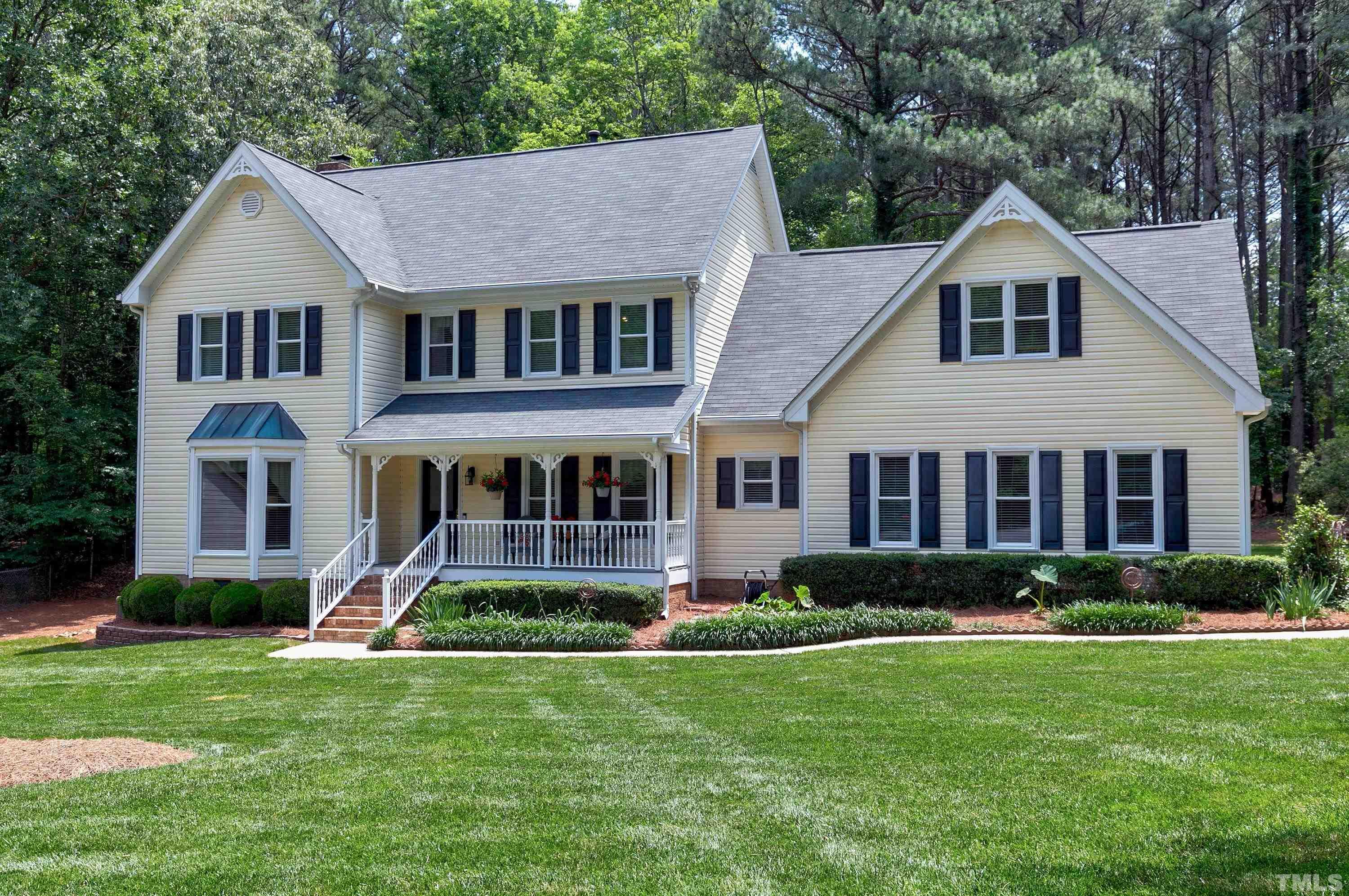 2905 Kenwick Court Raleigh, NC 27613 - Photo 43 of 45 a front view of a house with a yard and green space