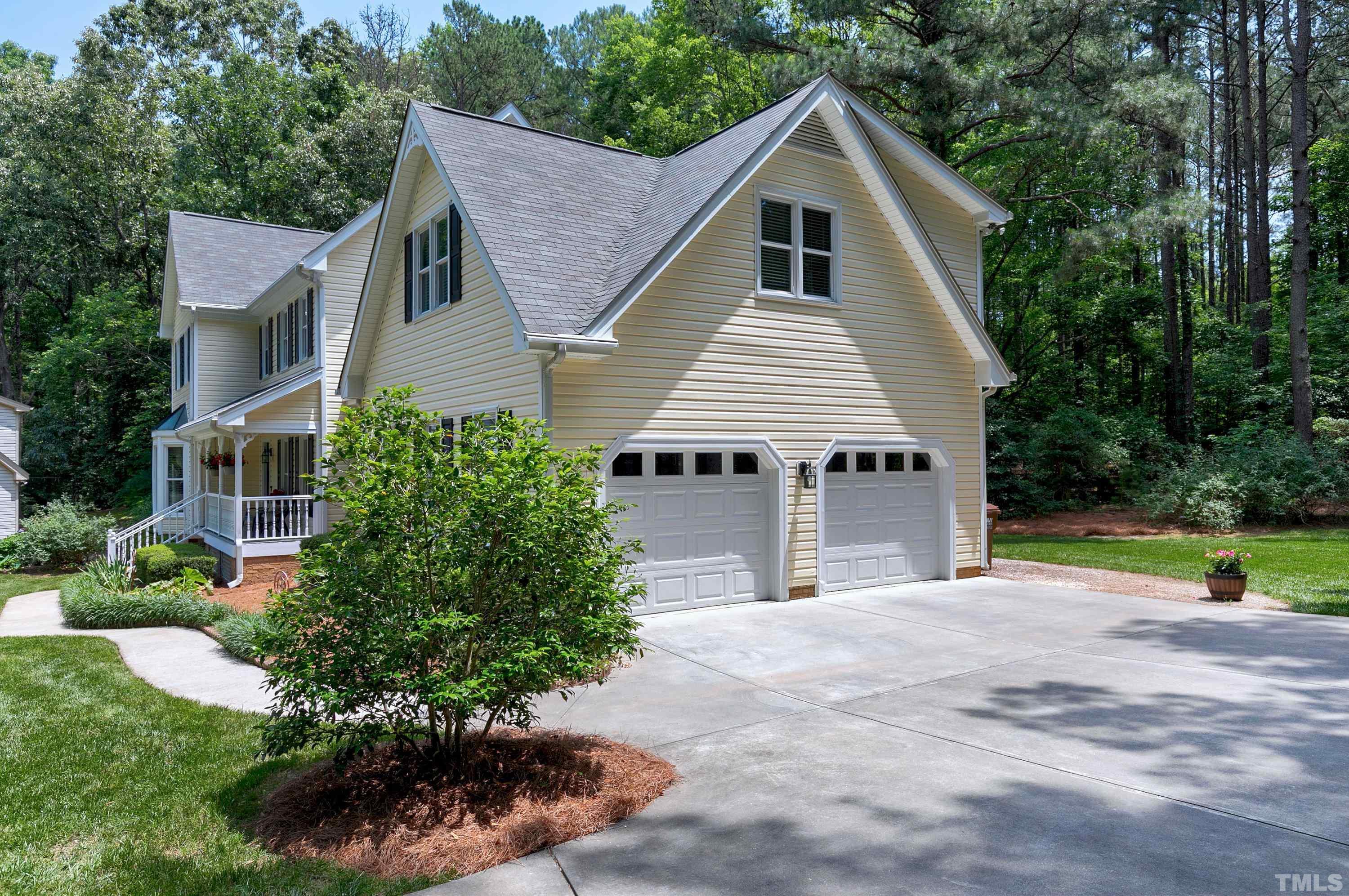 2905 Kenwick Court Raleigh, NC 27613 - Photo 44 of 45 a view of a house with a yard and potted plants