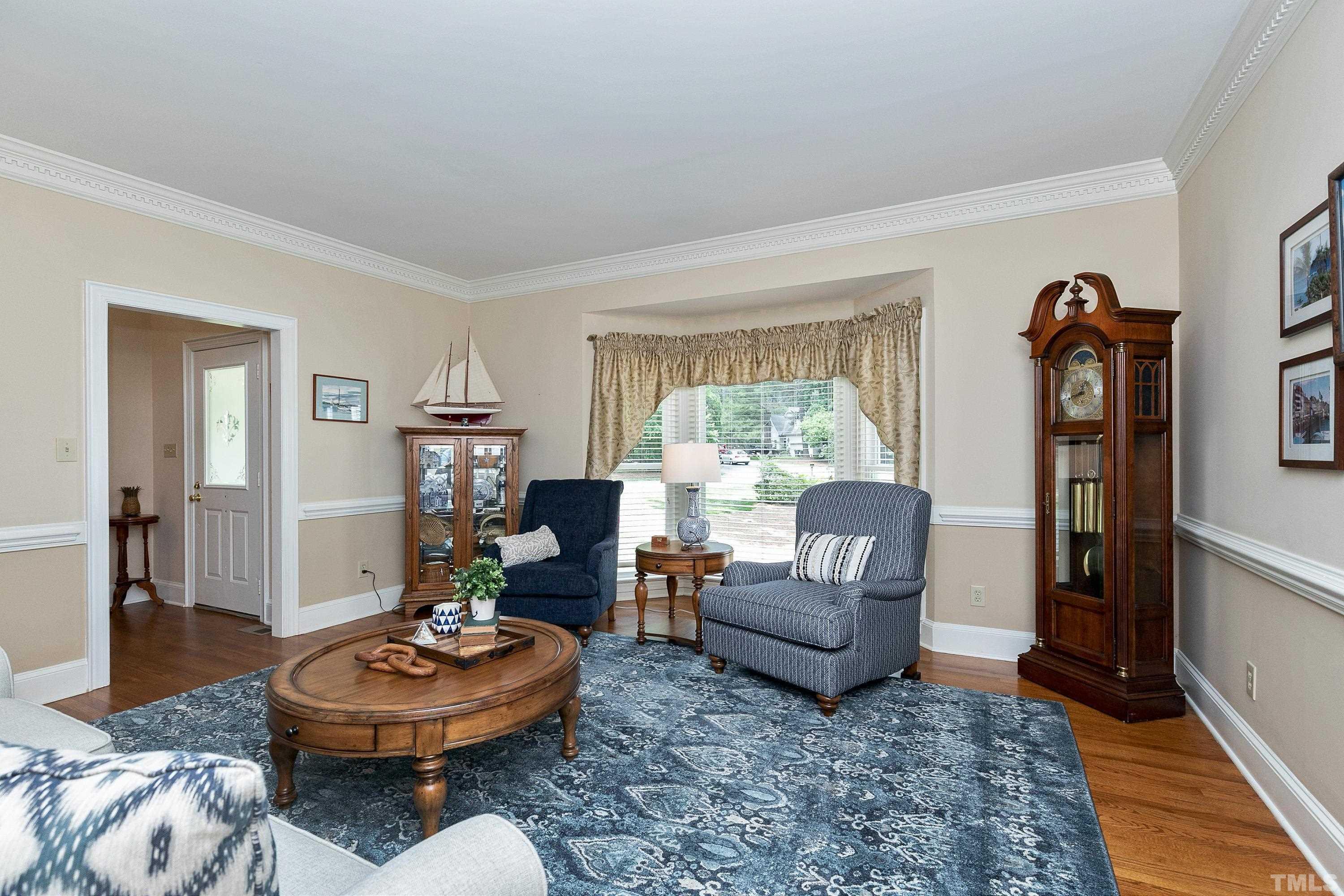 2905 Kenwick Court Raleigh, NC 27613 - Photo 6 of 45 a living room with furniture and a wooden floor