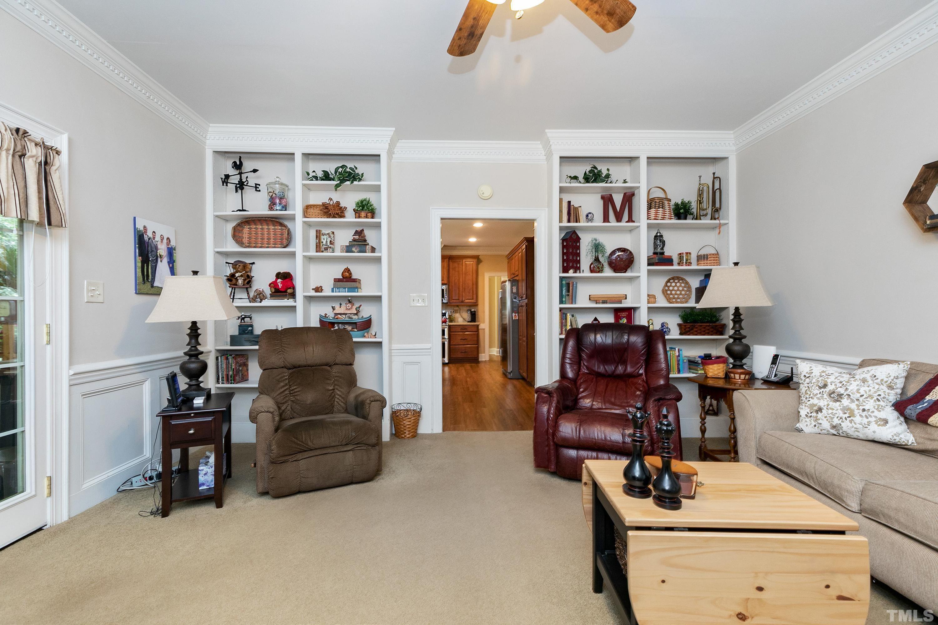 2905 Kenwick Court Raleigh, NC 27613 - Photo 8 of 45 a living room with furniture and gym equipment