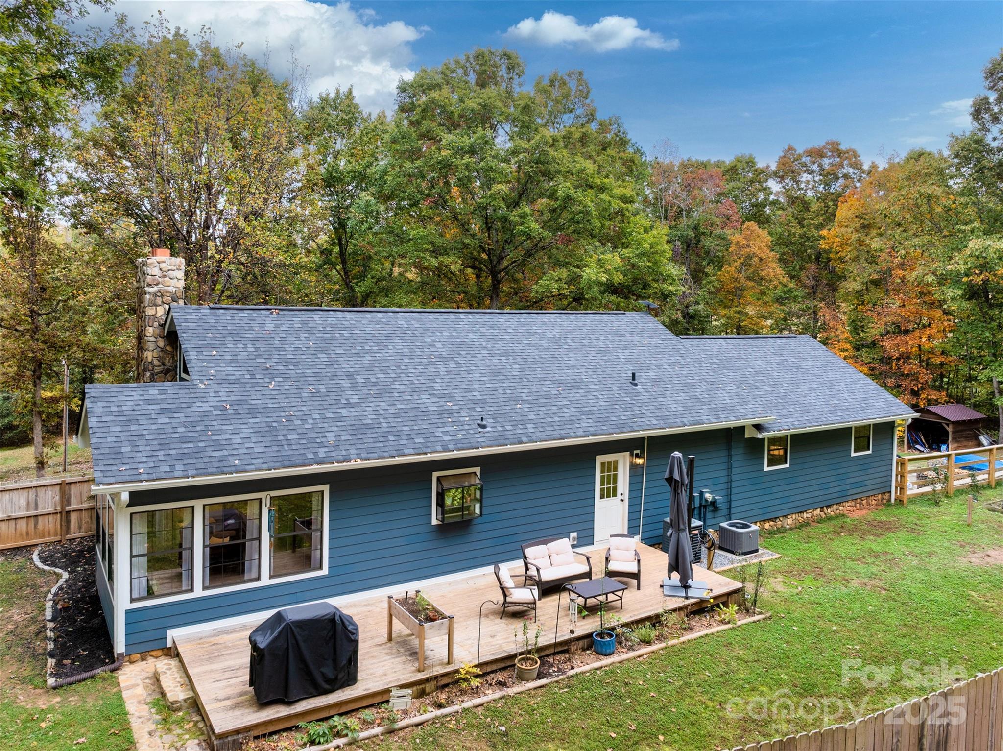 3124 Clark Loop Morganton, NC 28655 - Photo 42 of 48 a backyard of a house with table and chairs