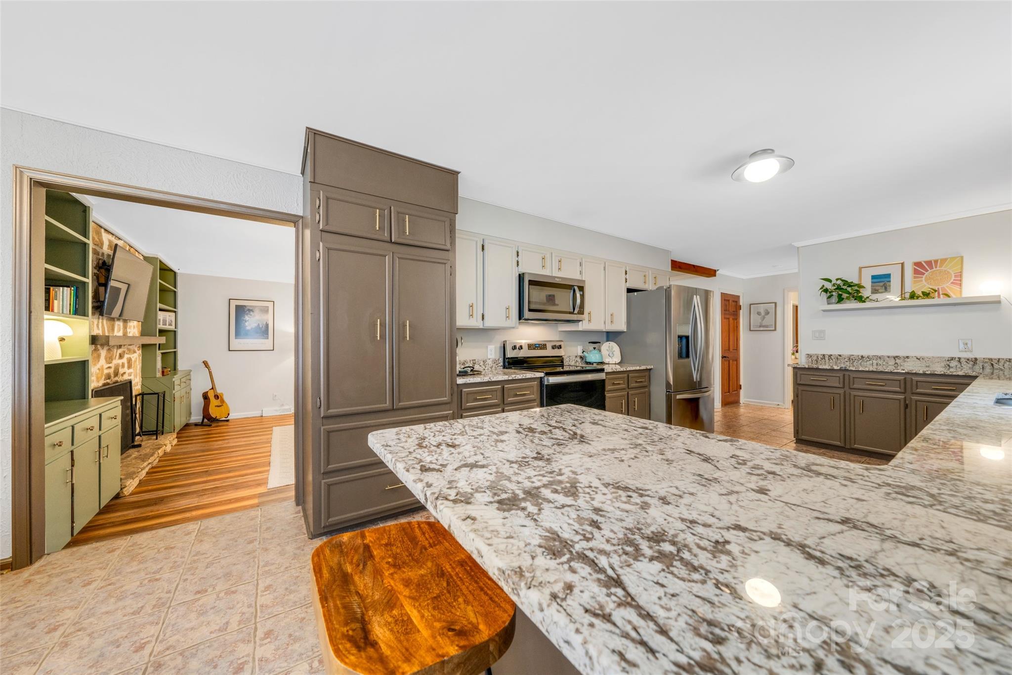 3124 Clark Loop Morganton, NC 28655 - Photo 9 of 48 a large kitchen with cabinets and wooden floor