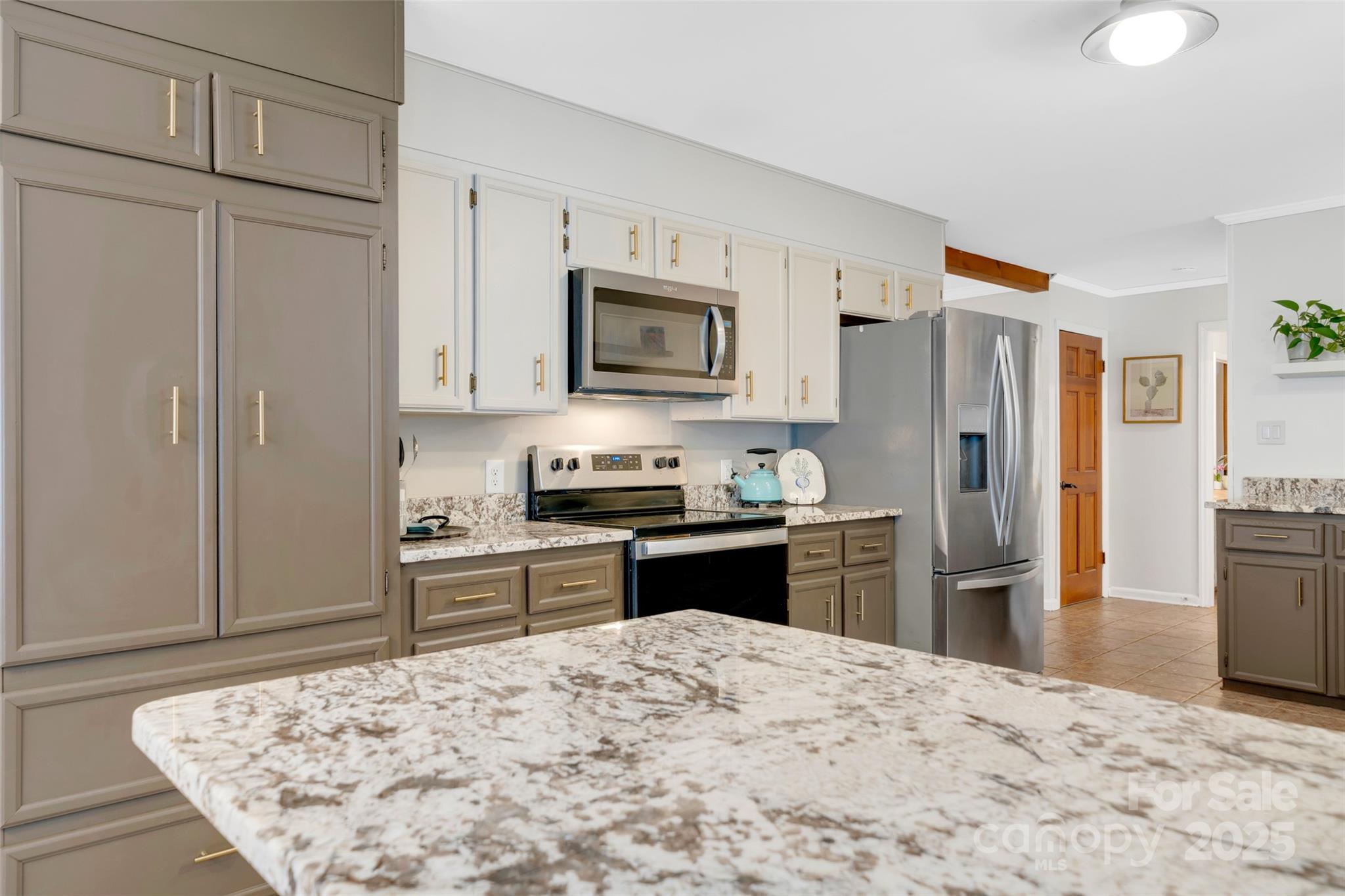 3124 Clark Loop Morganton, NC 28655 - Photo 10 of 48 a kitchen with granite countertop a refrigerator stove top oven and sink
