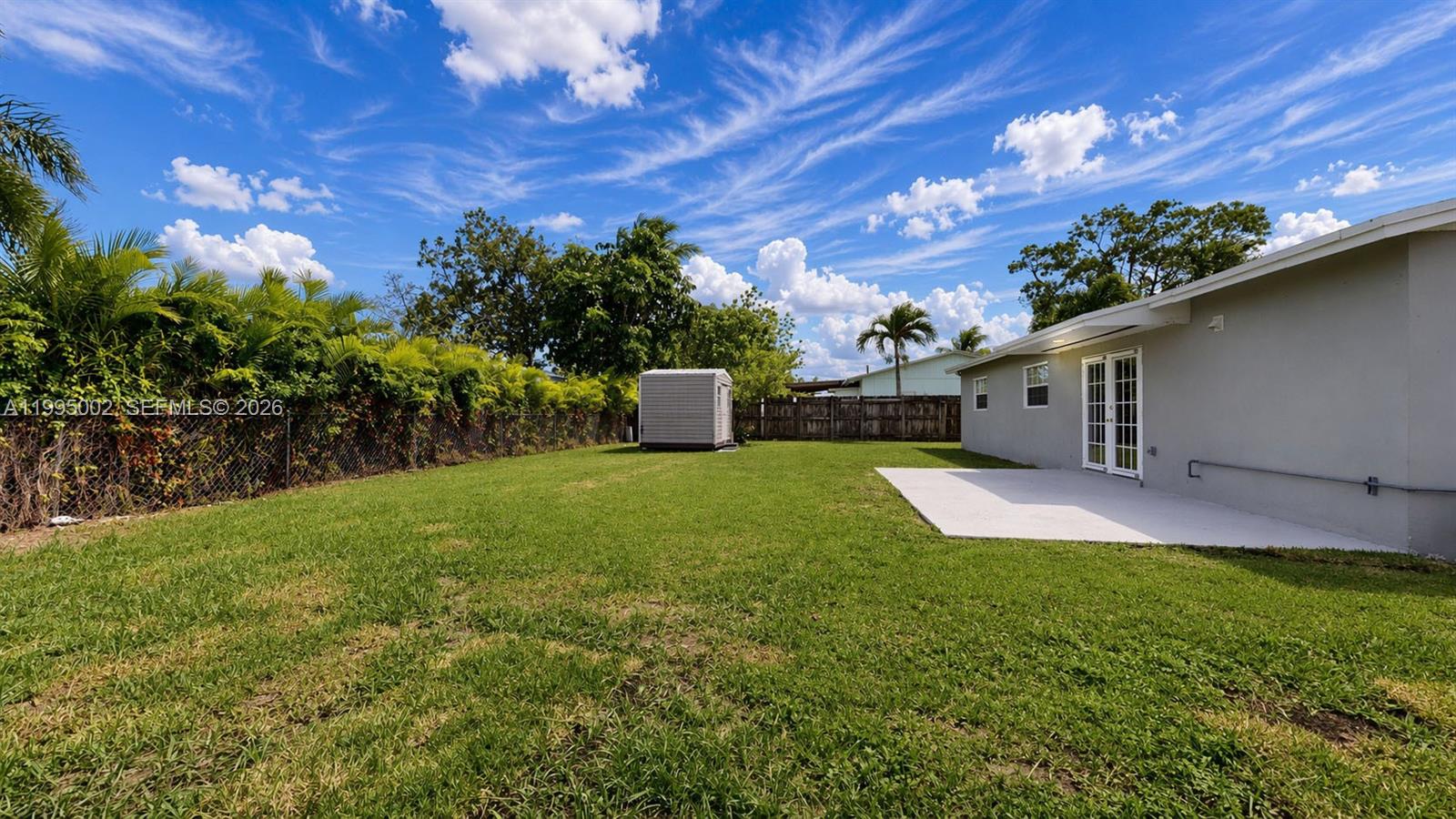 15305 Southwest 104th Avenue Miami, FL 33157 - Photo 11 of 46 a backyard of a house with lots of green space